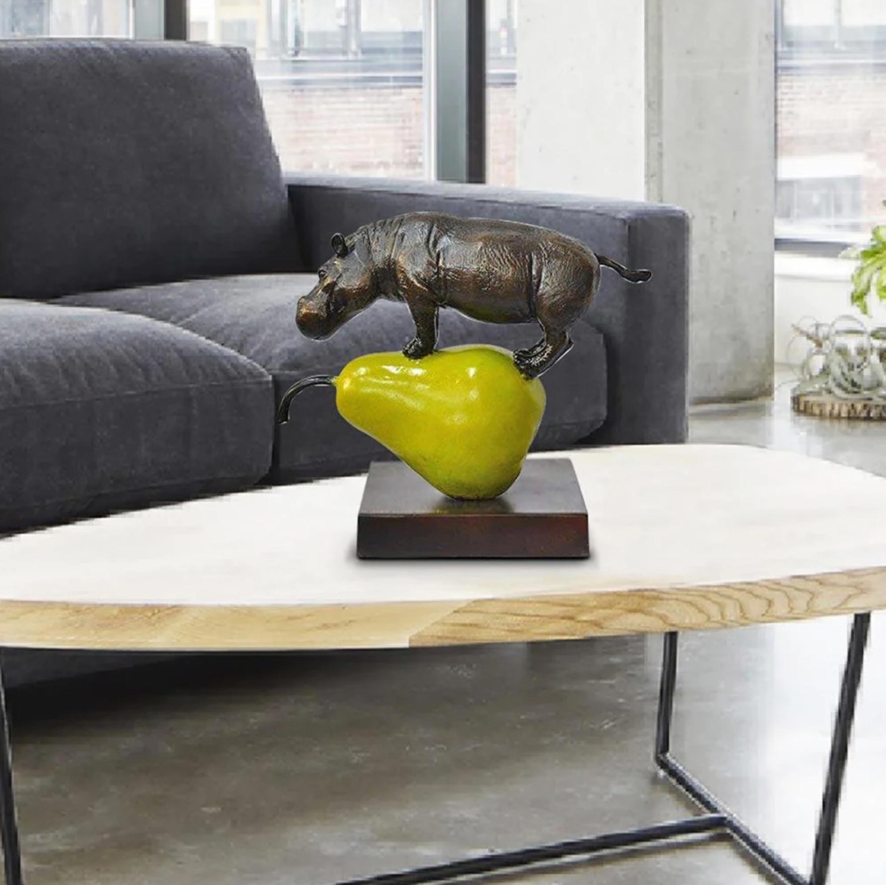 Title: The hippo was just pearfect
Authentic Small Bronze Sculpture

This authentic bronze sculpture titled 'The hippo was just pearfect' by artists Gillie and Marc has been meticulously crafted in bronze with gold patina . This sculpture features a