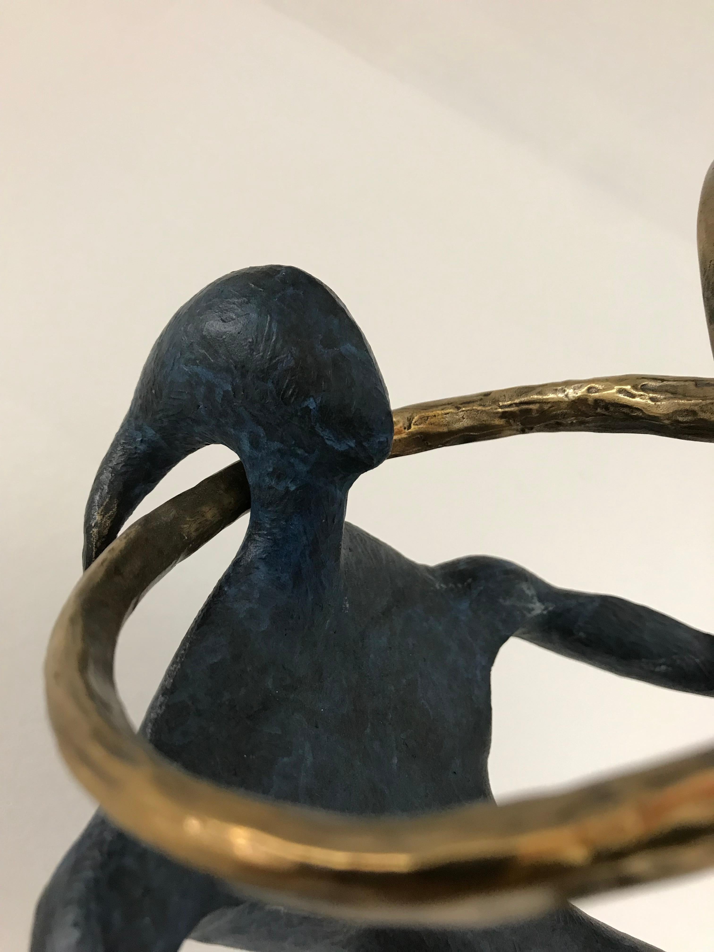 The Ring is a bronze sculpture with blue and golden patina on black marble base.  Size : 20