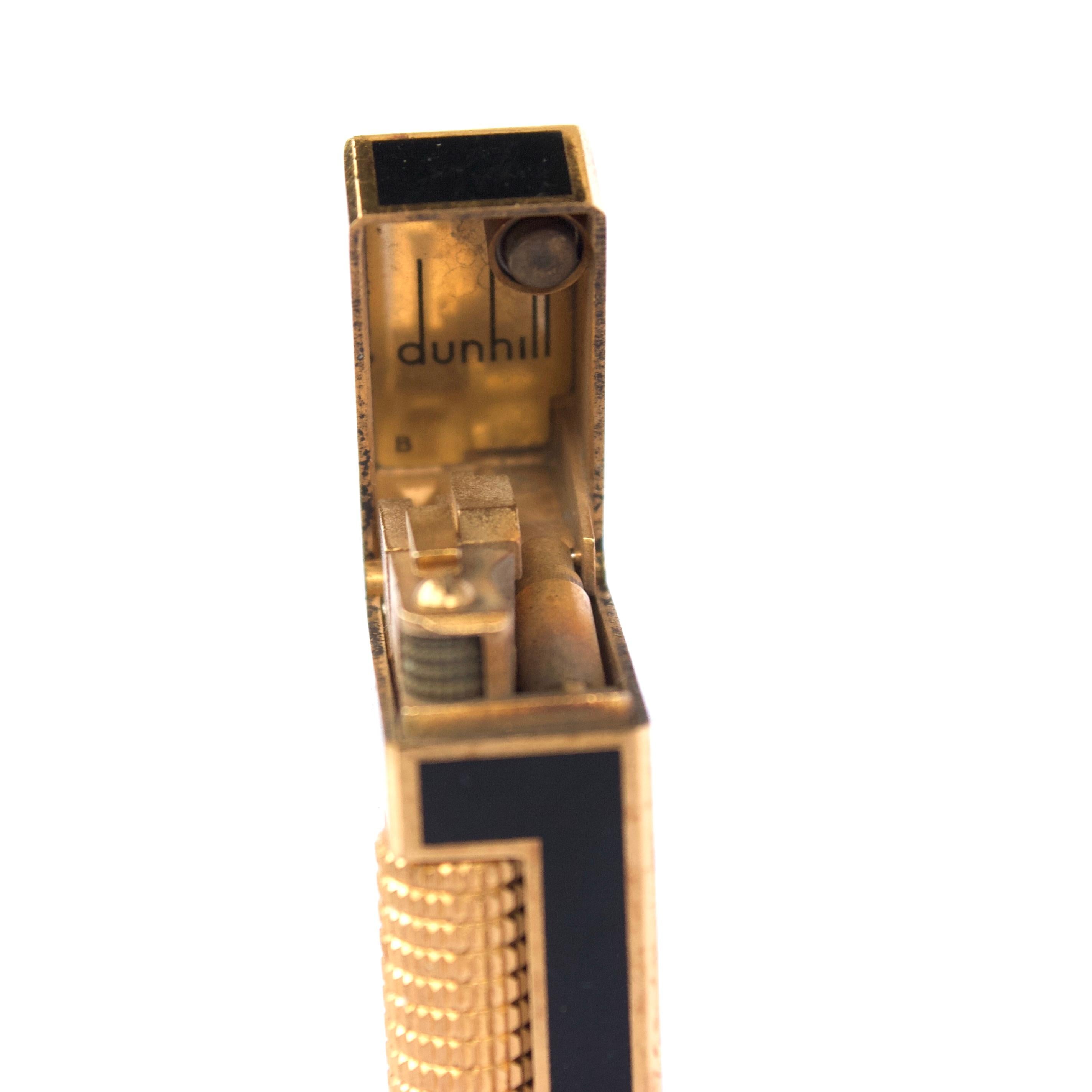 Luxurious vintage 18k gold plated Dunhill Rollagas lighter with black enamel.