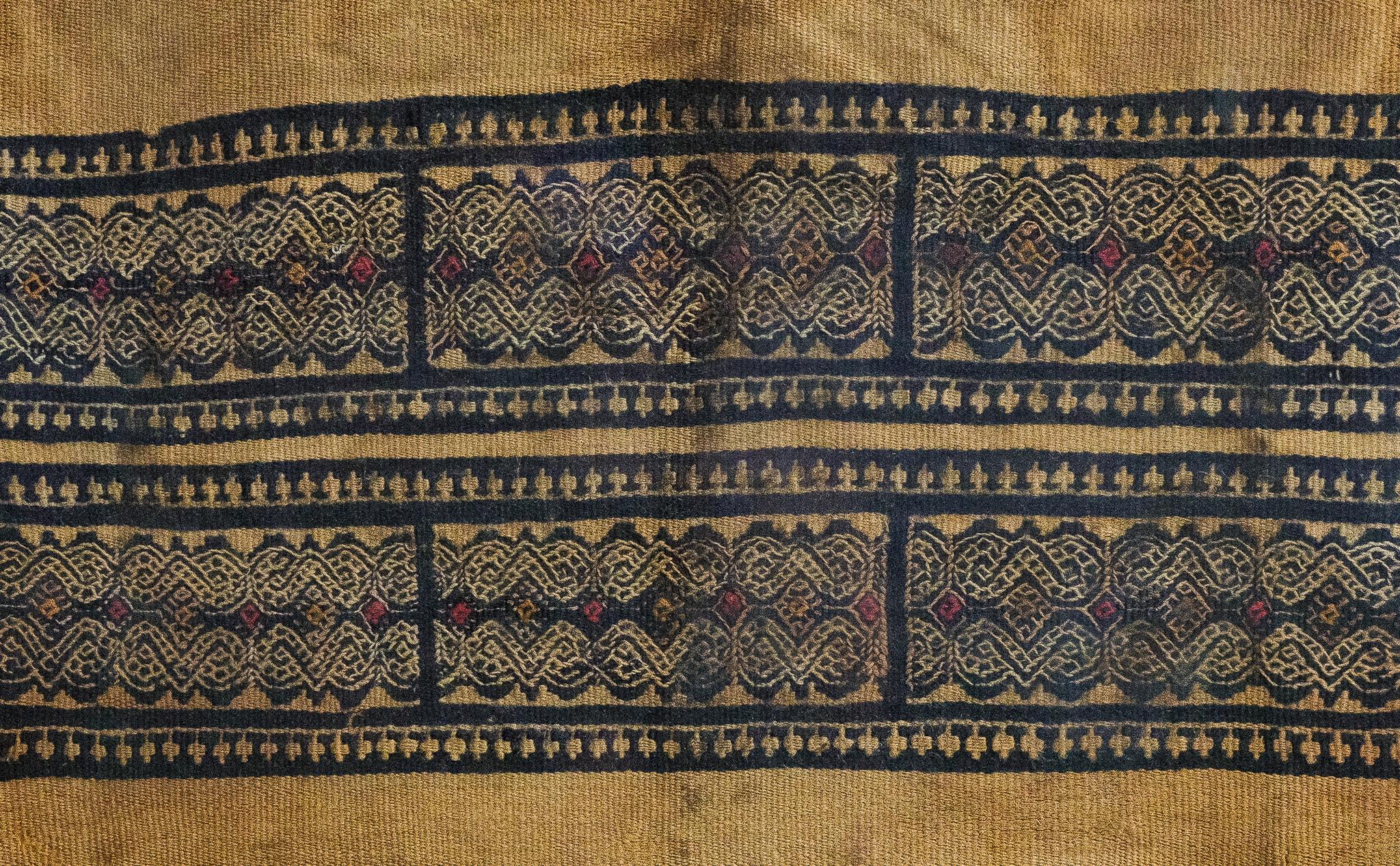Textile size 8.5 x 10 in.
Frame size 13.5 x 15 in.

This piece is an ancient Coptic Egyptian textile fragment, dating from the 3rd to 5th century CE. It is composed of a coarse, plain-weave linen material in a natural, light brown hue. A wide,