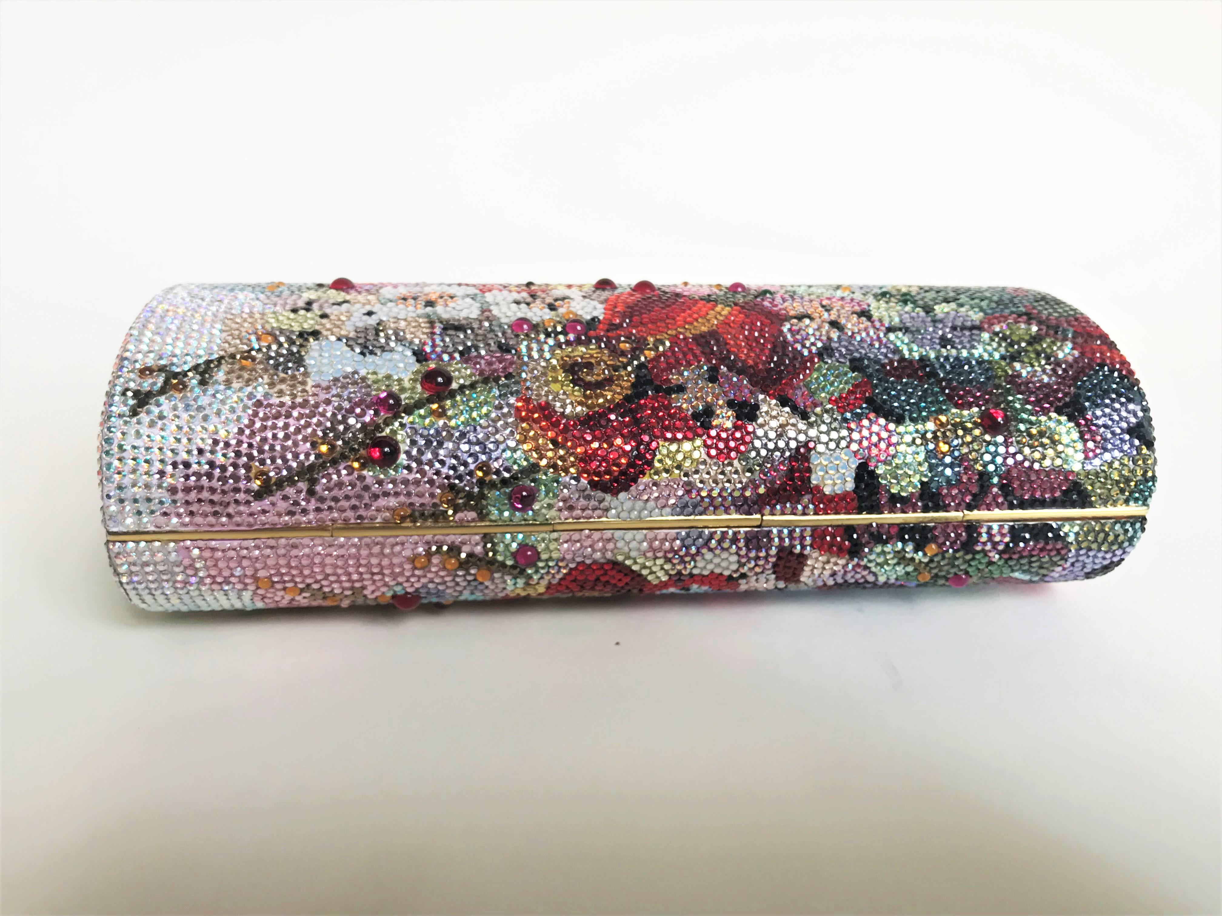 BEAUTIFUL Judith Leiber Vintage Swarovski Crystal Floral Print Barrel Minaudiere Evening Bag in excellent condition. Multicolor swarovski crystal exterior in a unique floral print pattern. Gold button closure opens to a gold leather interior. Hidden