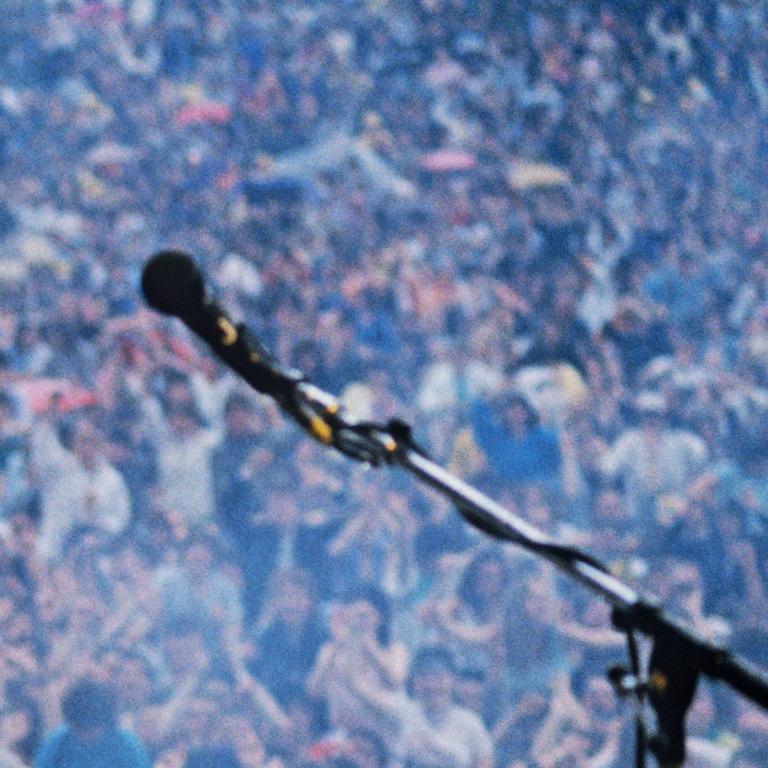 Freddie Mercury, Queen in Concert, Magic Tour, Slane Castle, County Meath, 1986 - Gray Color Photograph by Richard Young