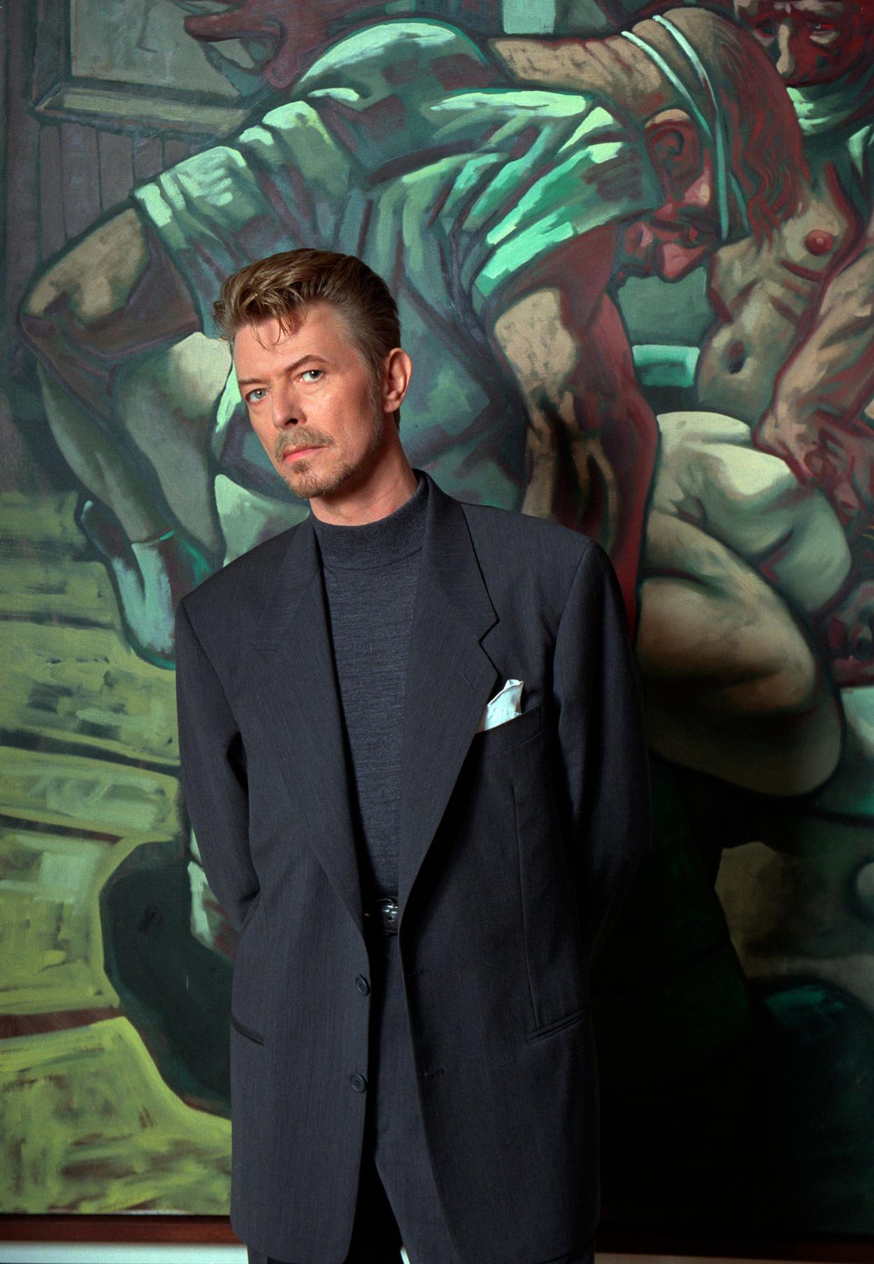 Richard Young Color Photograph - David Bowie with a Painting by Peter Howson, London, 1994, Photography
