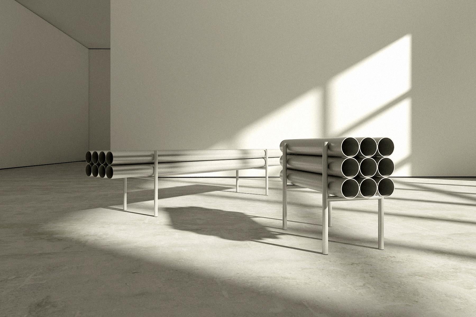 Polished Aluminum Sleek bench, perfect for indoors or outdoors. This long chromed like bench exists at a cross section between sculpture, design, and furniture design. Eight individual polished aluminum tubes seem like floating in space.  

Deon