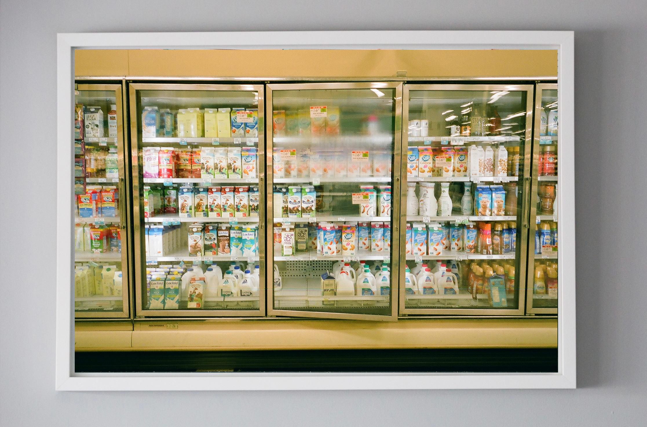 Color photograph of Supermarket interior, Fogged glass doors and colors  - Brown Color Photograph by Fernanda Torcida