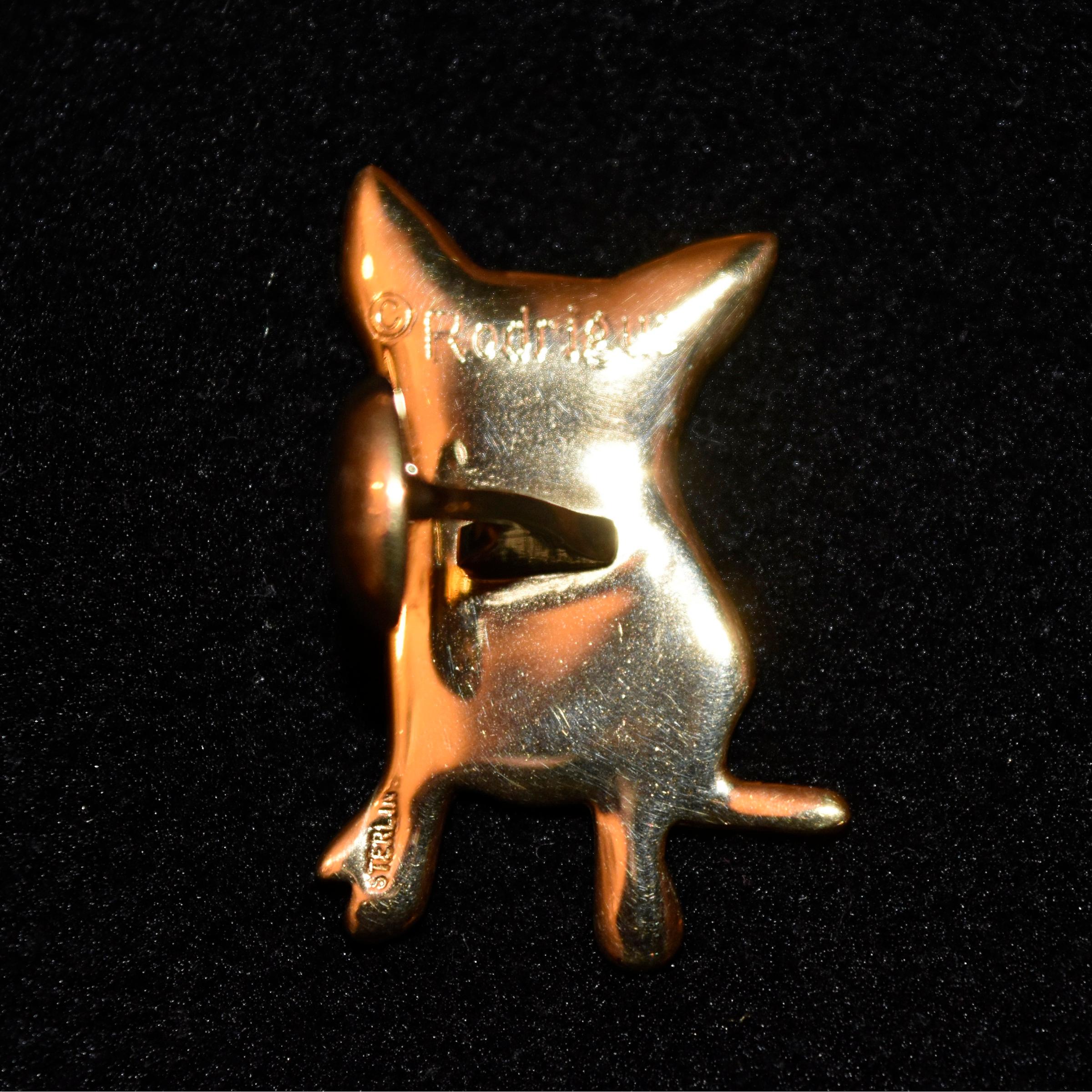 Artist:  George Rodrigue
Title:  Blue Dog Sterling/Gold Plated Cufflinks
Medium:  Foundry Jewelry
Date:  Circa 1993
Dimensions:  1 1/4
