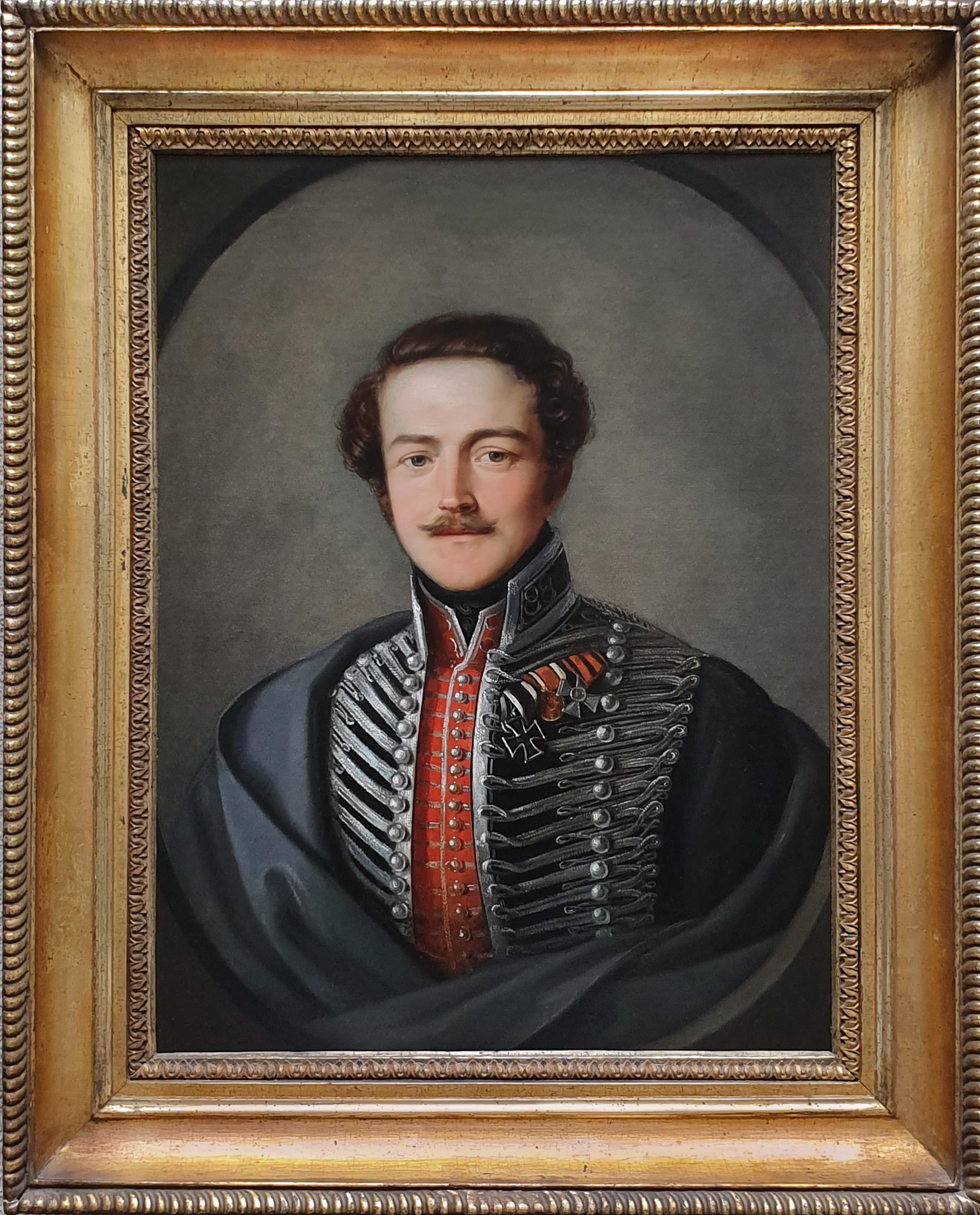 Titan Fine Art is pleased to present this exquisite bust length portrait a striking young gentleman is wearing a formal military uniform of scarlet and black coat profusely decorated with multiple rows of silver frogging, buttons and silver