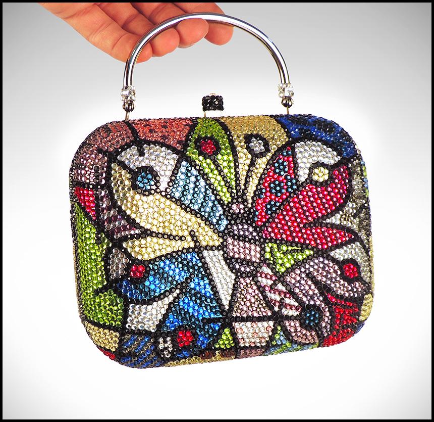 Romero Britto Authentic and Original Butterfly Clutch with Swarovski Crystals, listed with the Submit Best Offer option

Accepting Offers Now: The item up for sale is a spectacular and rare, clutch/purse by Britto, that retails for significantly