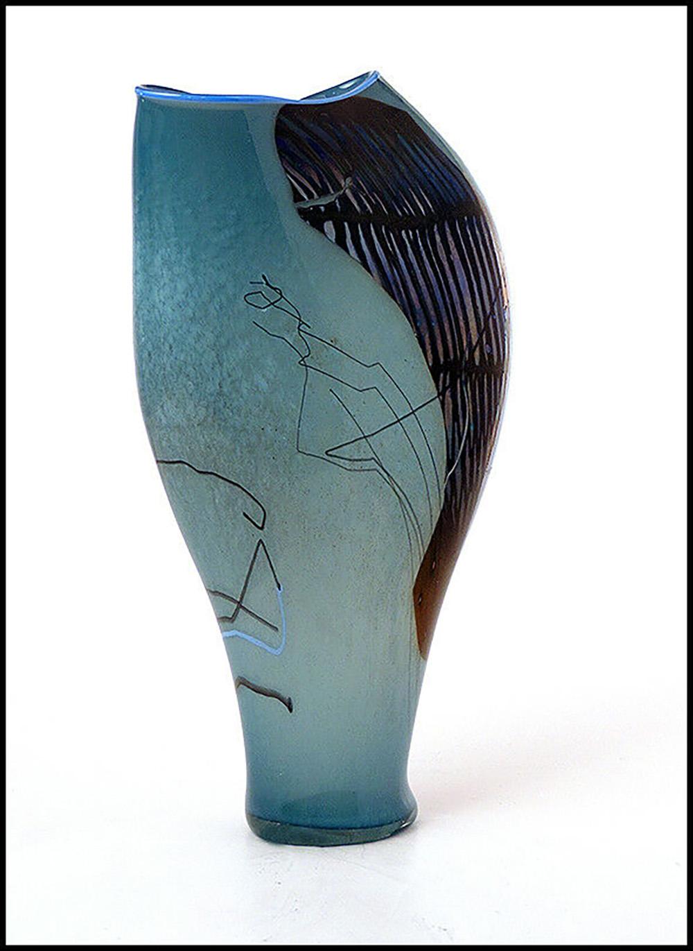 Artist: William Morris
Title: Original Blue Shard Vessel
Medium: Hand Blown Glass
Year: 1980
Edition Number: Original Vessel
Artwork Size: 10.5 x 5.5 inches