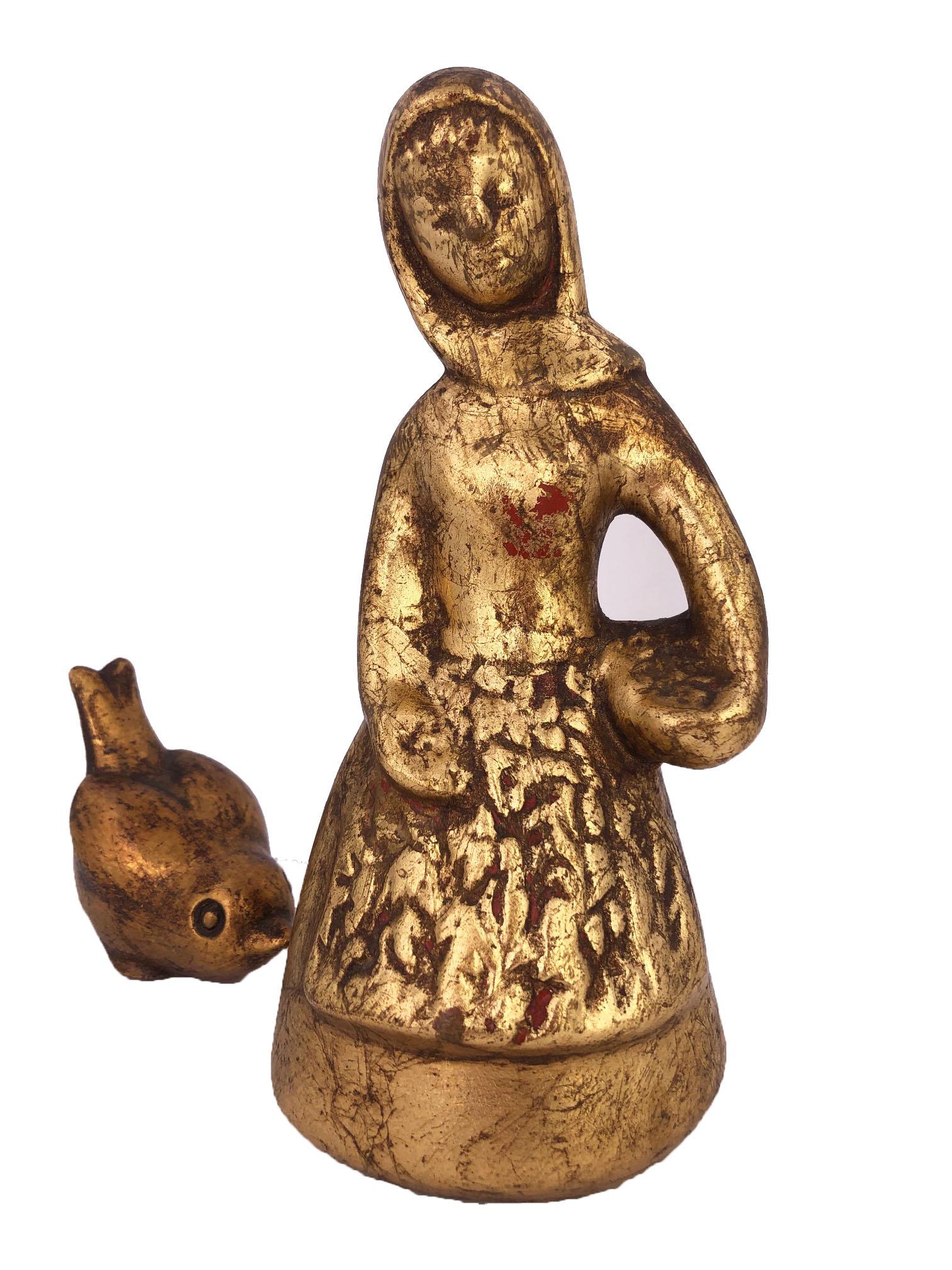 Girl and Bird Ceramic Sculpture by artist Howard Pierce, gold color, red 