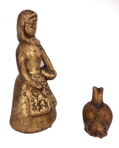 Girl and Bird Ceramic Sculpture by artist Howard Pierce, gold color, red