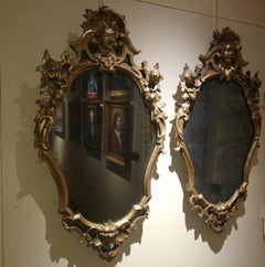 Coppia di specchi rococò toscane in legno dorato