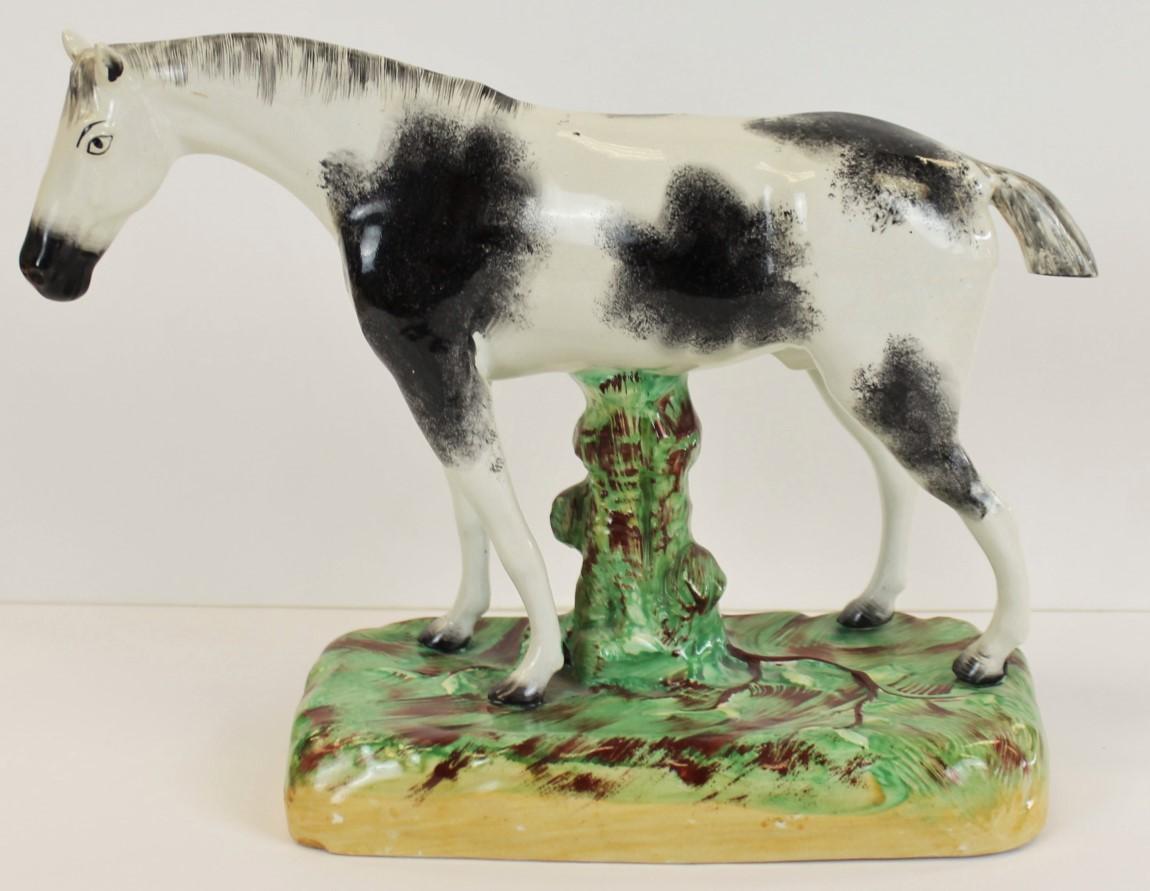 Superb/ 'unrestored' condition

Staffordshire Ware England

One 'sponged' in grey, the other in ochre

on canted rectangular mounts splashed in a green glaze

Circa 1900

Provenance:

Property from the equestrian estate of our grandfather, Major Jay