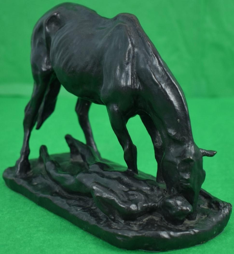 horse drinking water sculpture