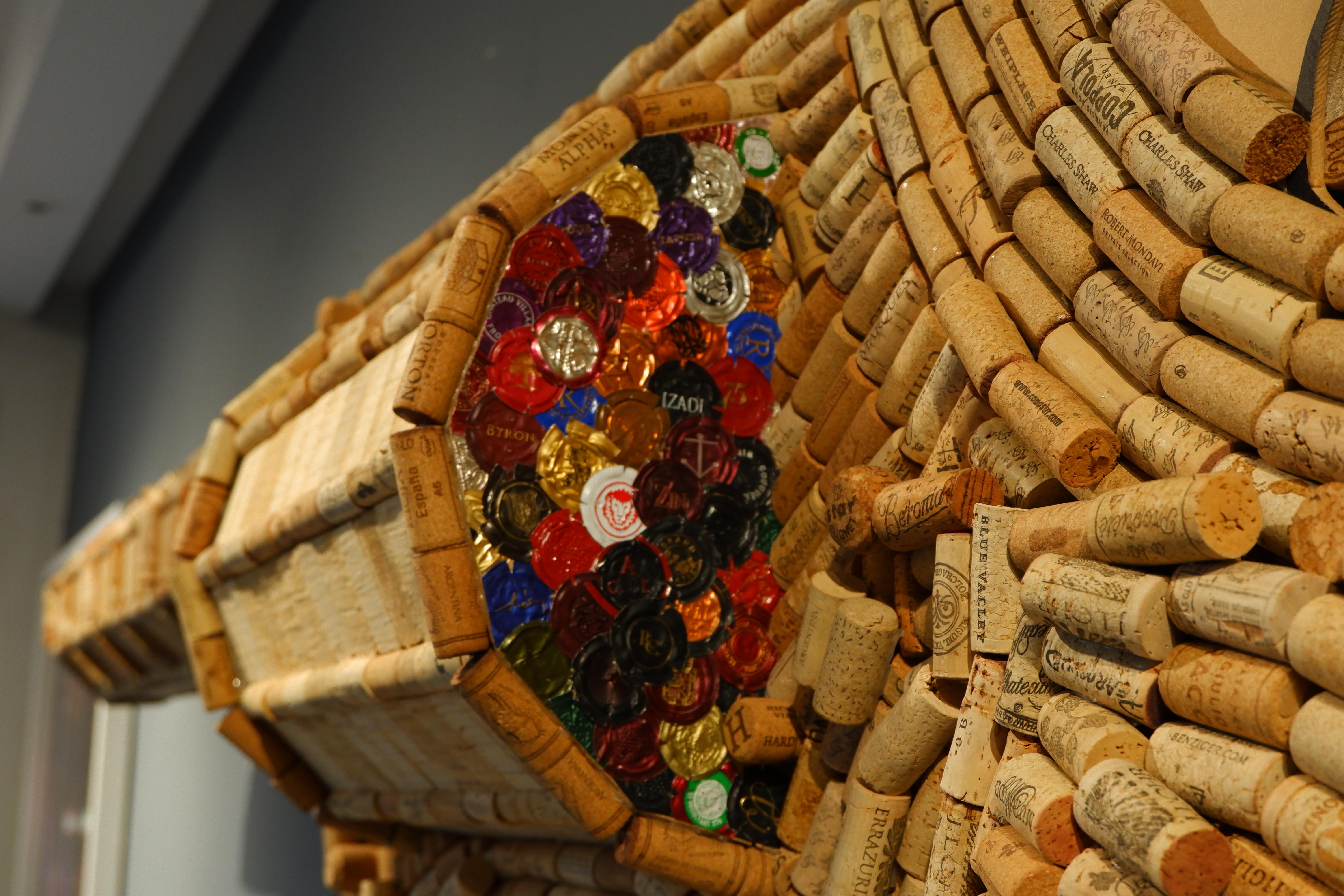 Guns Pop; wood based, made out of approx. 2400 recycled Wine and Champaign corks, It's unique.

Obsessed with wine corks, consumer culture, and mechanical, Costa Rican commercial artist Audie created some of the most iconic natural sculptures. As