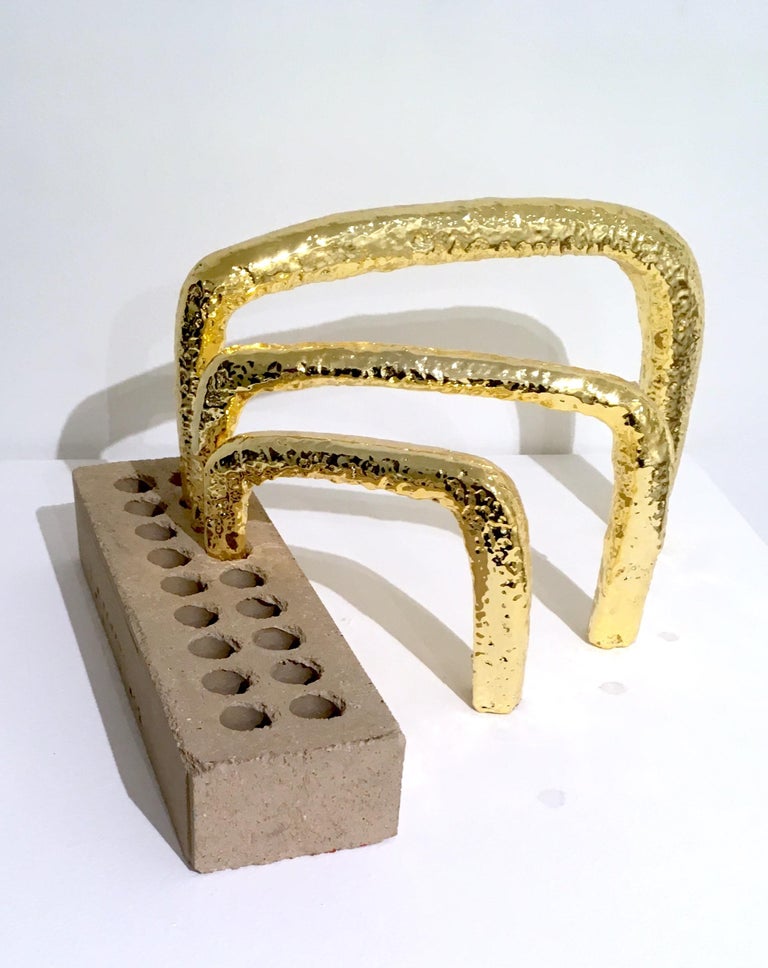 Brick and 14K gold electroplated styrofoam
