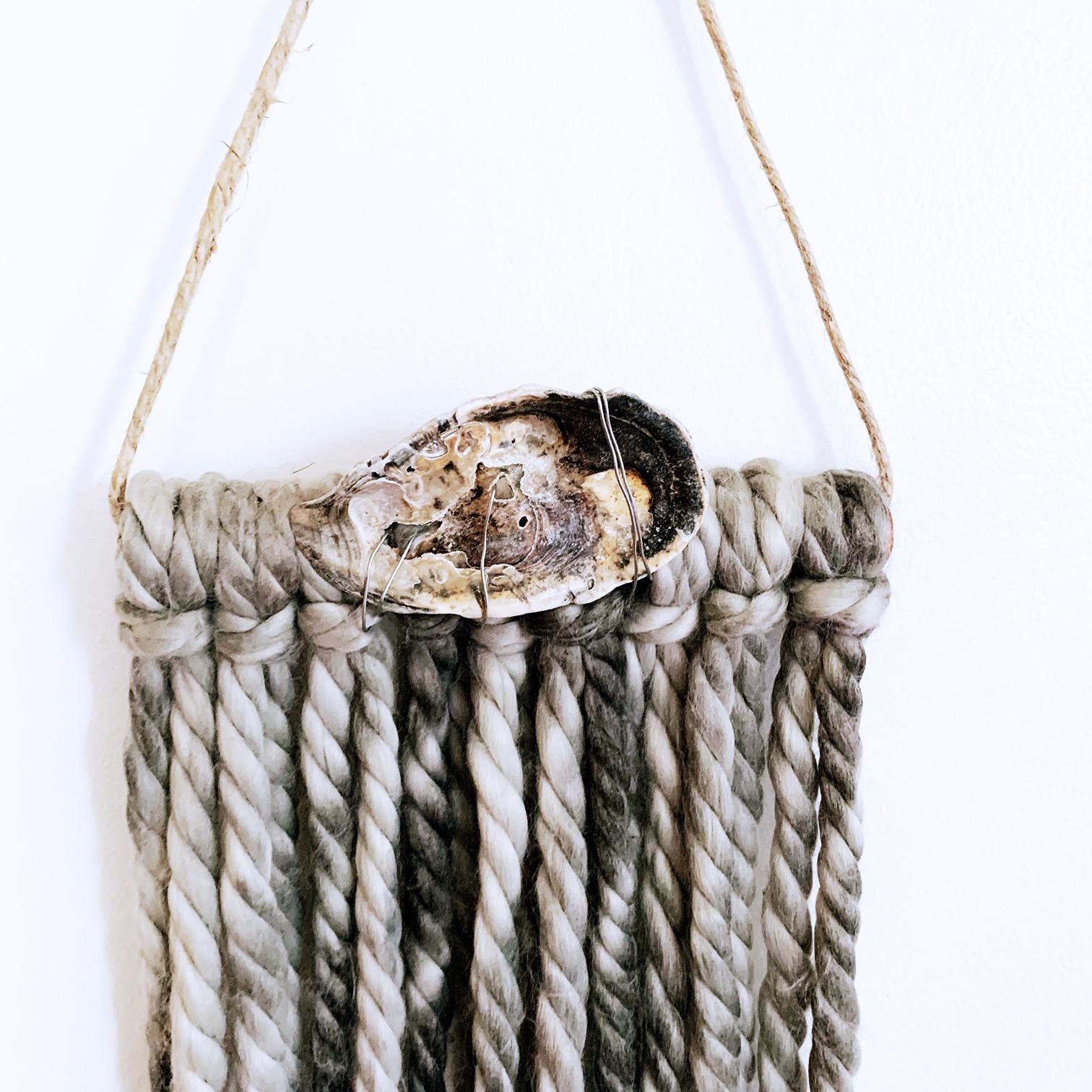 Shadow Dive, 2020, yarn, oyster shell, wire, copper pole, jute, decorative wall hanging.