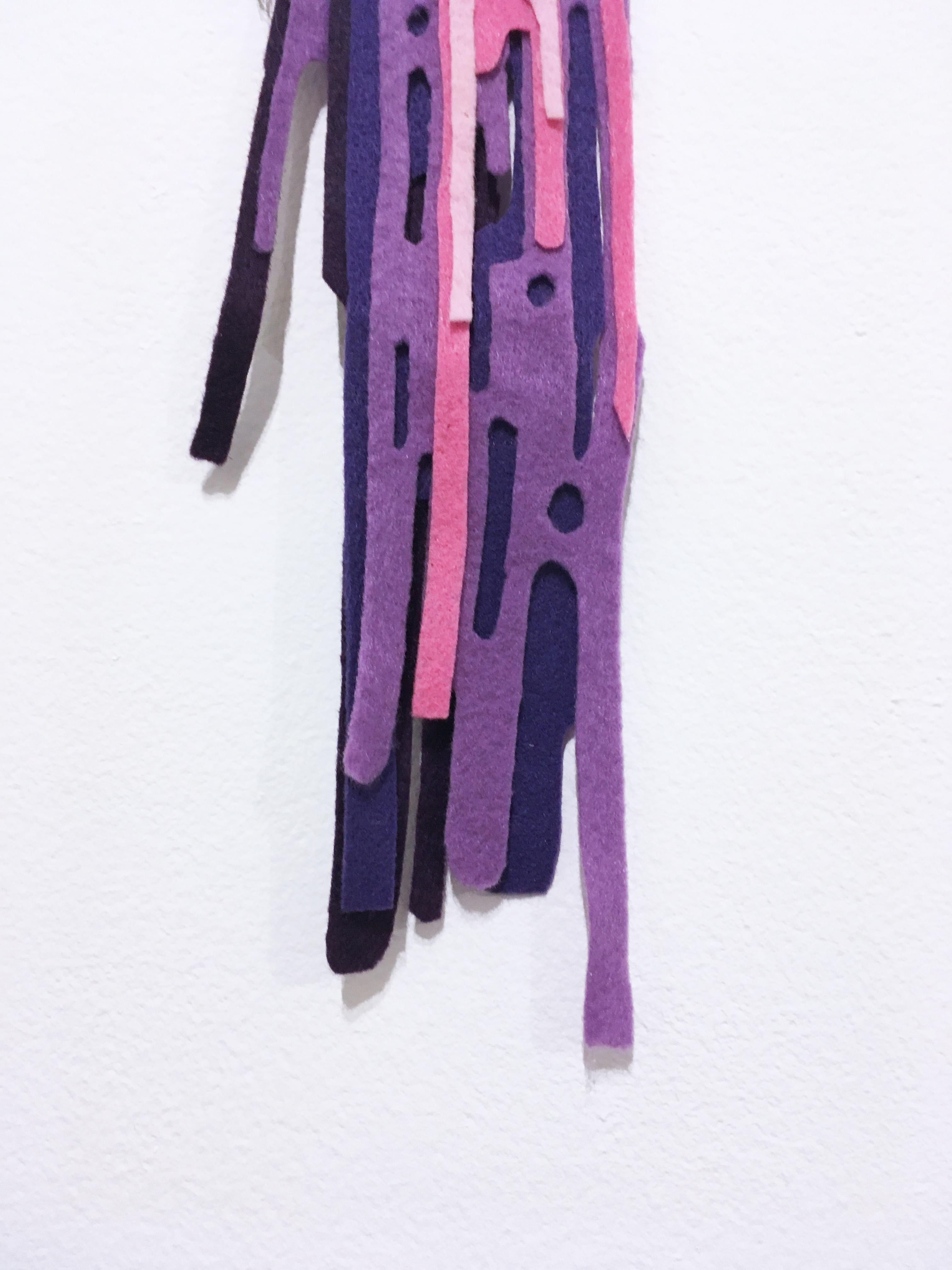 This truly unique piece is one of a kind, made in 2018 with a found object (paint brush), hand embellished with layered felt over acrylic paint in various shades of pink and purple, from light pink and fuschia to lavender and deep purple. This piece