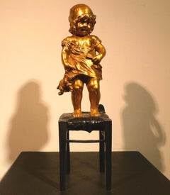 Antique "A Girl Climbed on a Stool Holding a Doll",  20th Century Bronze by Juan Clará