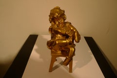  "A Girl Sitting on a Stool Tying Her Shoe", 20th Century Bronze by Juan Clará