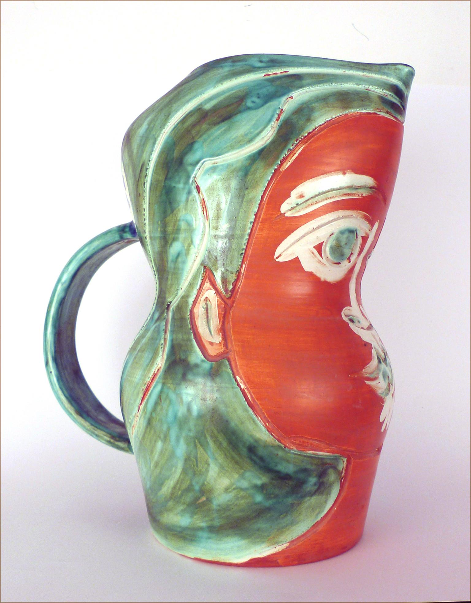 PABLO PICASSO 
Spanish, 1881-1973
VISAGE DE FEMME (A.R. 192)
stamped, marked and numbered 'Edition Picasso / Madoura Plein Feu / Edition Picasso / 154/200 / Madoura' (underneath)
white earthenware ceramic pitcher, partially engraved, with coloured