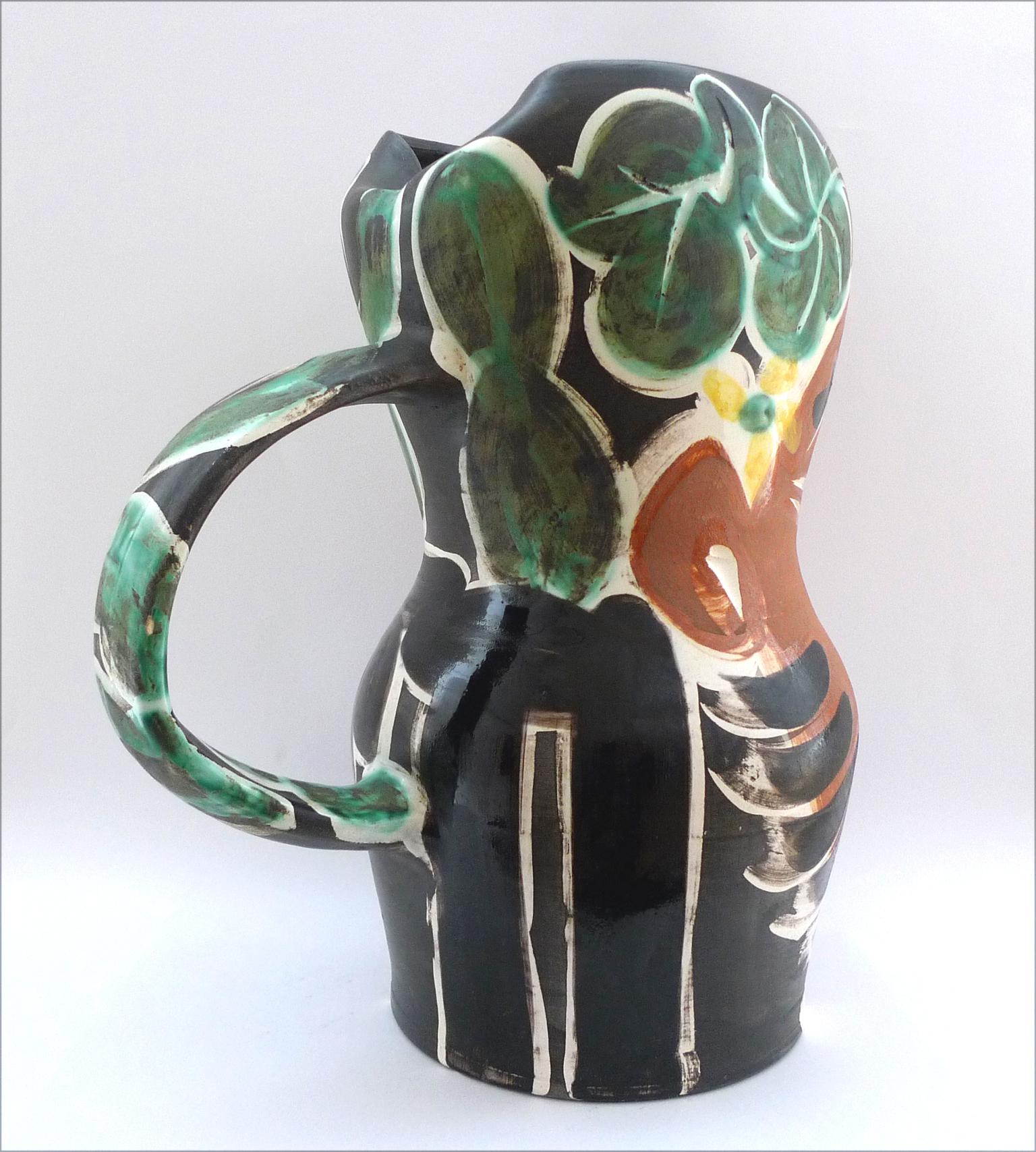 PABLO PICASSO (1881-1973)
LE BARBU (A.R. 217)
stamped and marked 'Edition Picasso/Madoura Plein Feu/Edition Picasso/Madoura' (underneath)
white earthenware ceramic pitcher, partially engraved, with colored engobe and glaze
Height: 12¾ in. (31.5
