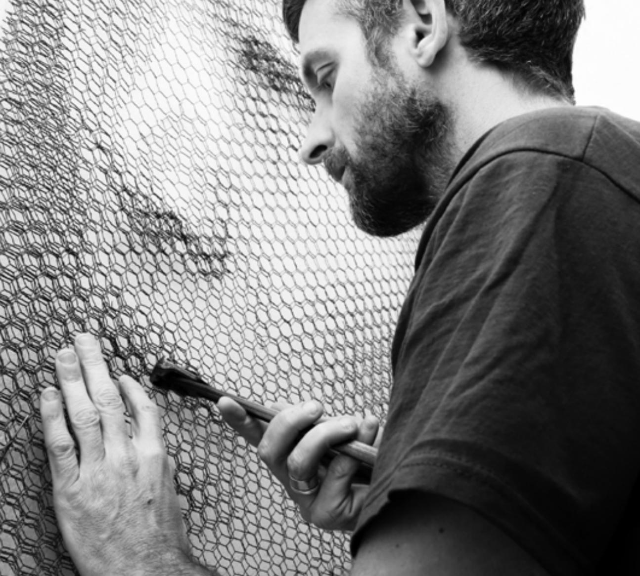 DIVINITA by Giorgio Tentolini. Original. Ten layers of black metal mesh on iron background. 45 x 45”. Framed in white gallery frame. 

Giorgio Tentolini was born in Casalmaggiore, Italy in 1978. He studied Graphic Arts at the Art Institute Toschi in