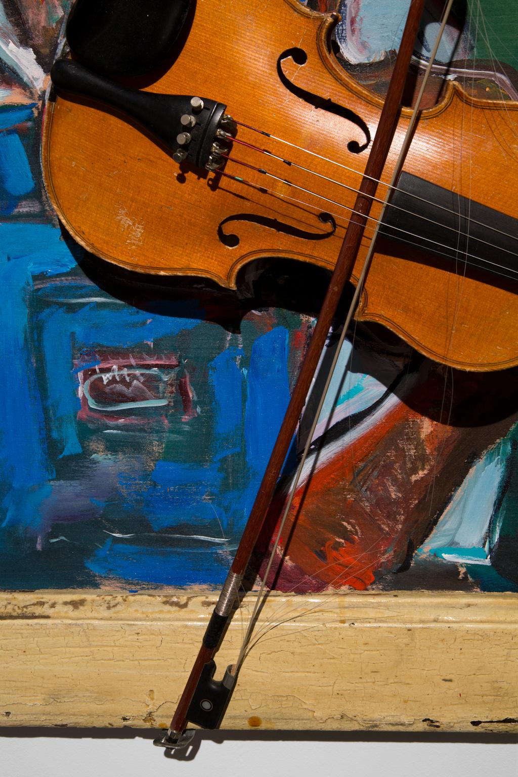 Wayne Manns has been a lover of music and art his entire life. He is a self-taught “Outsider Artist” or “Folk Artist” and paints the world around him. “Violin Player” is a colorful, delightful example of his love of and response to music, musicians