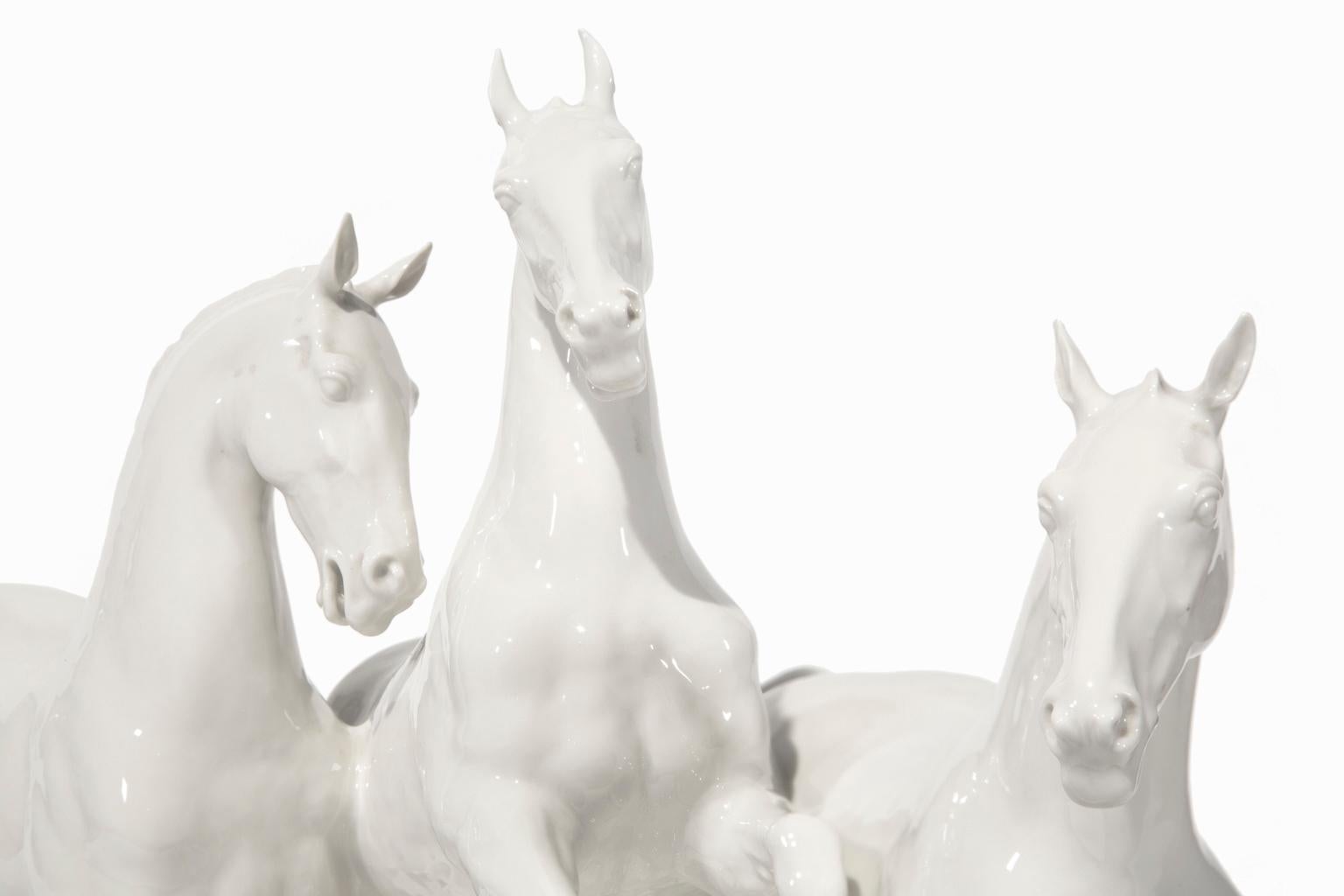 This gorgeous porcelain sculpture from Hutschenreuther porcelain is of three galloping horses, sculpted in exquisite detail by the sculptor, Hans Achtziger. Hans Achtziger was a designer and porcelain modeller who trained  from 1937-1939 at the