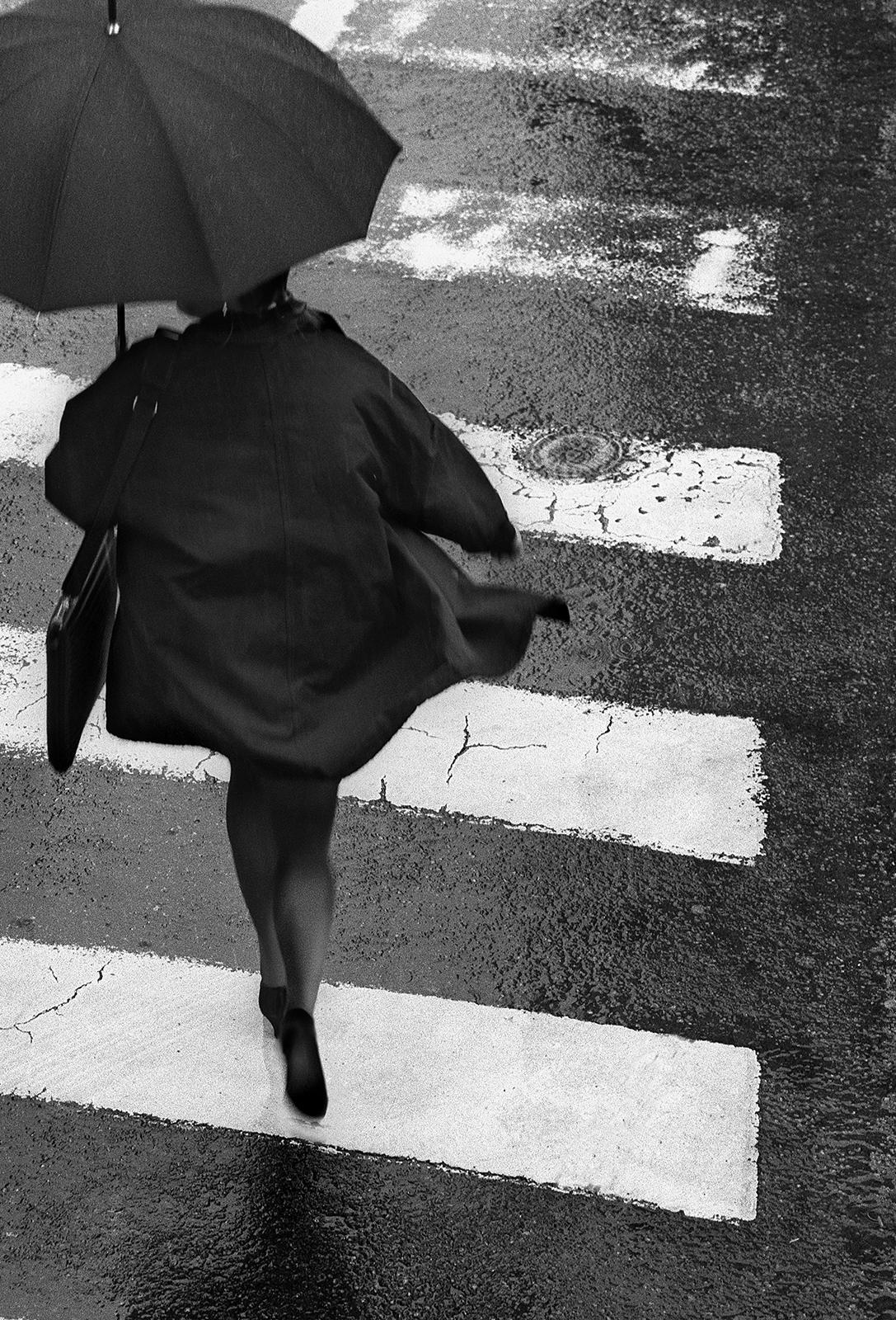 Umbrella- Signed limited edition still life print, Black white, Woman running  - Photograph by Ian Sanderson