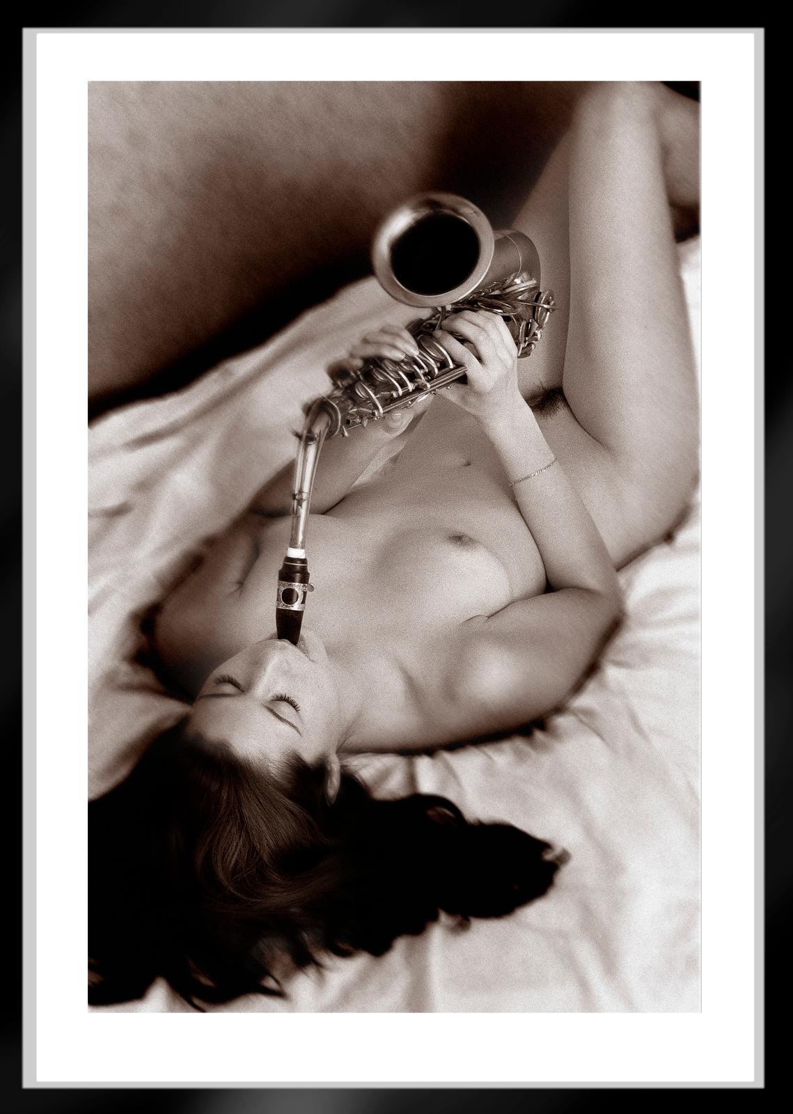 Sax- Signed limited edition sepia print, Contemporary nude woman photo in bed - Gray Nude Photograph by Ian Sanderson