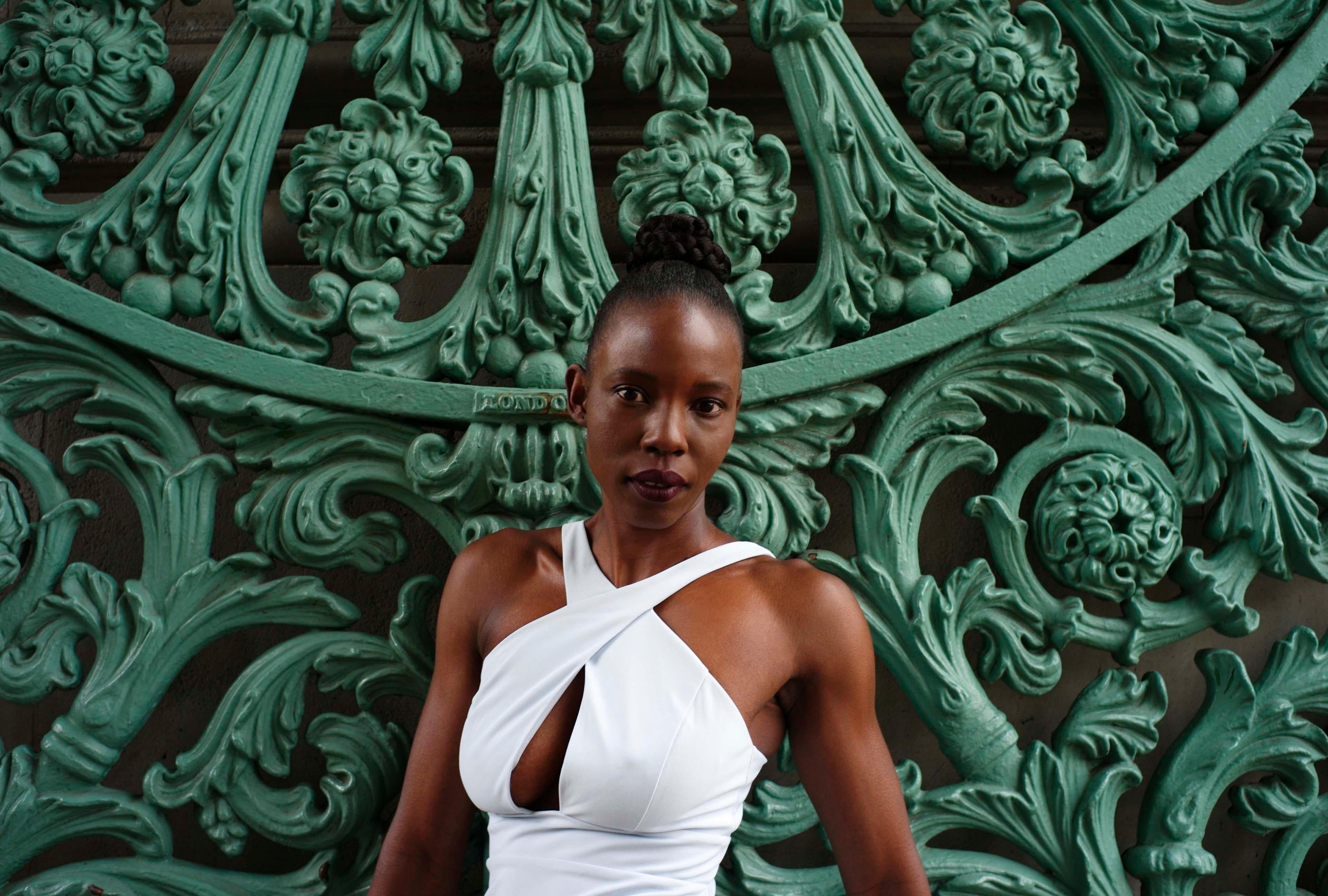 Heun Jung Kim Color Photograph - Untitled - Contemporary Portrait of Black African Woman in London Green + White