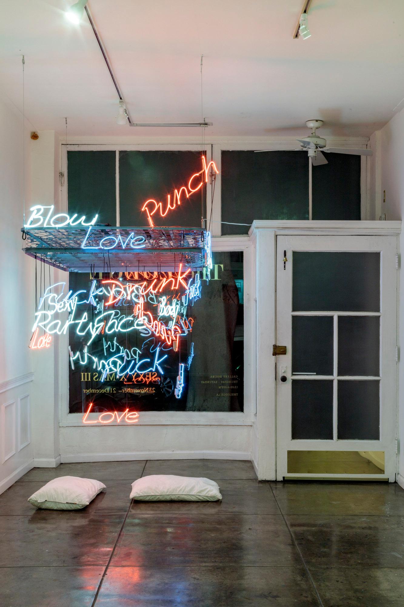 This is the center piece to draw attention! With is neon lights and hanging mattress frame Carl brings his vision of love, lust, and relationships full circle. Ideal for a lobby or foyer.
Hopgood had his two debut solo exhibitions Arrivals,