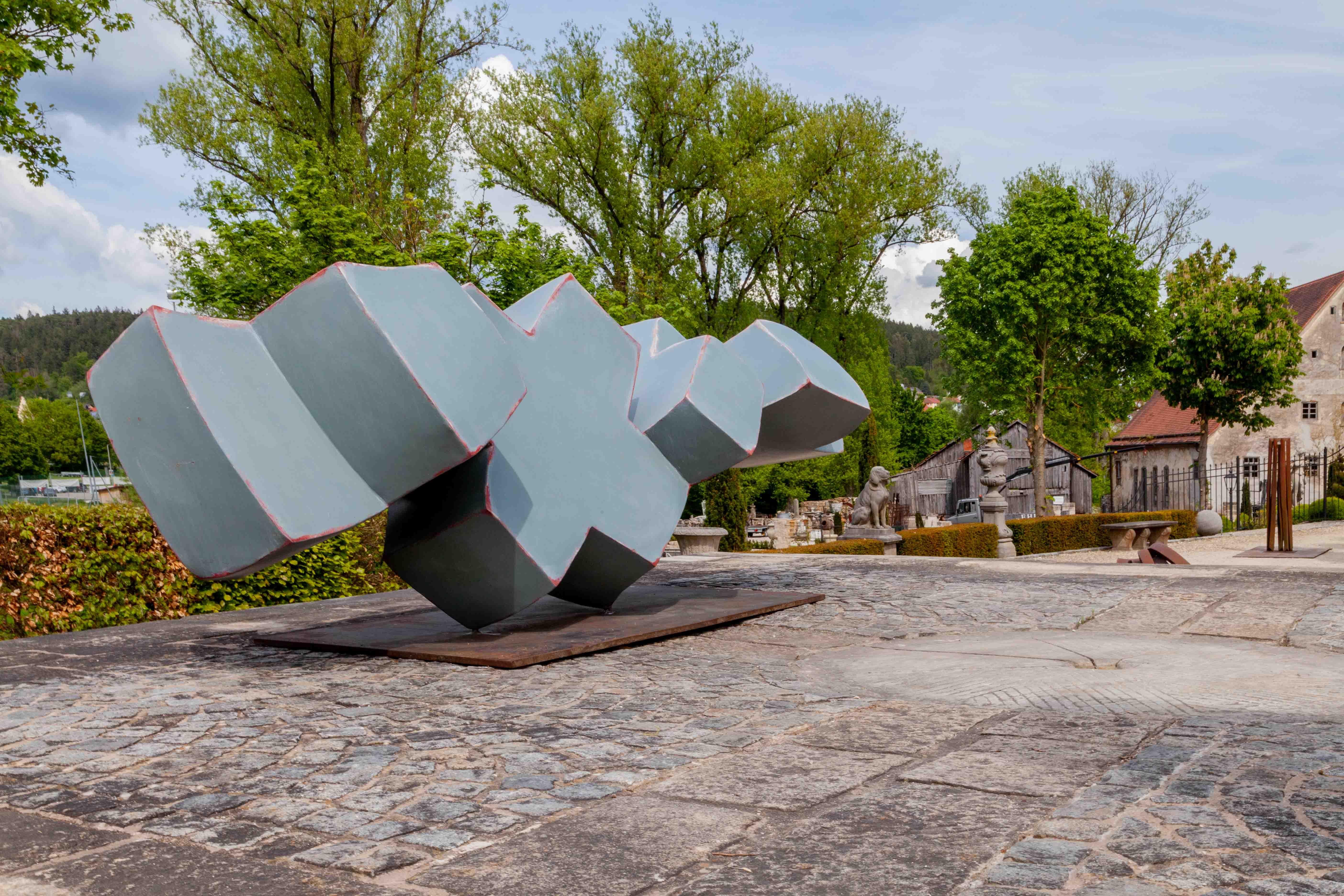 Sculpture „XXXX“ by Jörg Bach (born 1964, Wolgast - Germany) out of Corten and lacquer, no. 24, 116 x 333 x 133 cm.

Primarily active as a sculptor - but not only - he creates sculptures that are titled 
