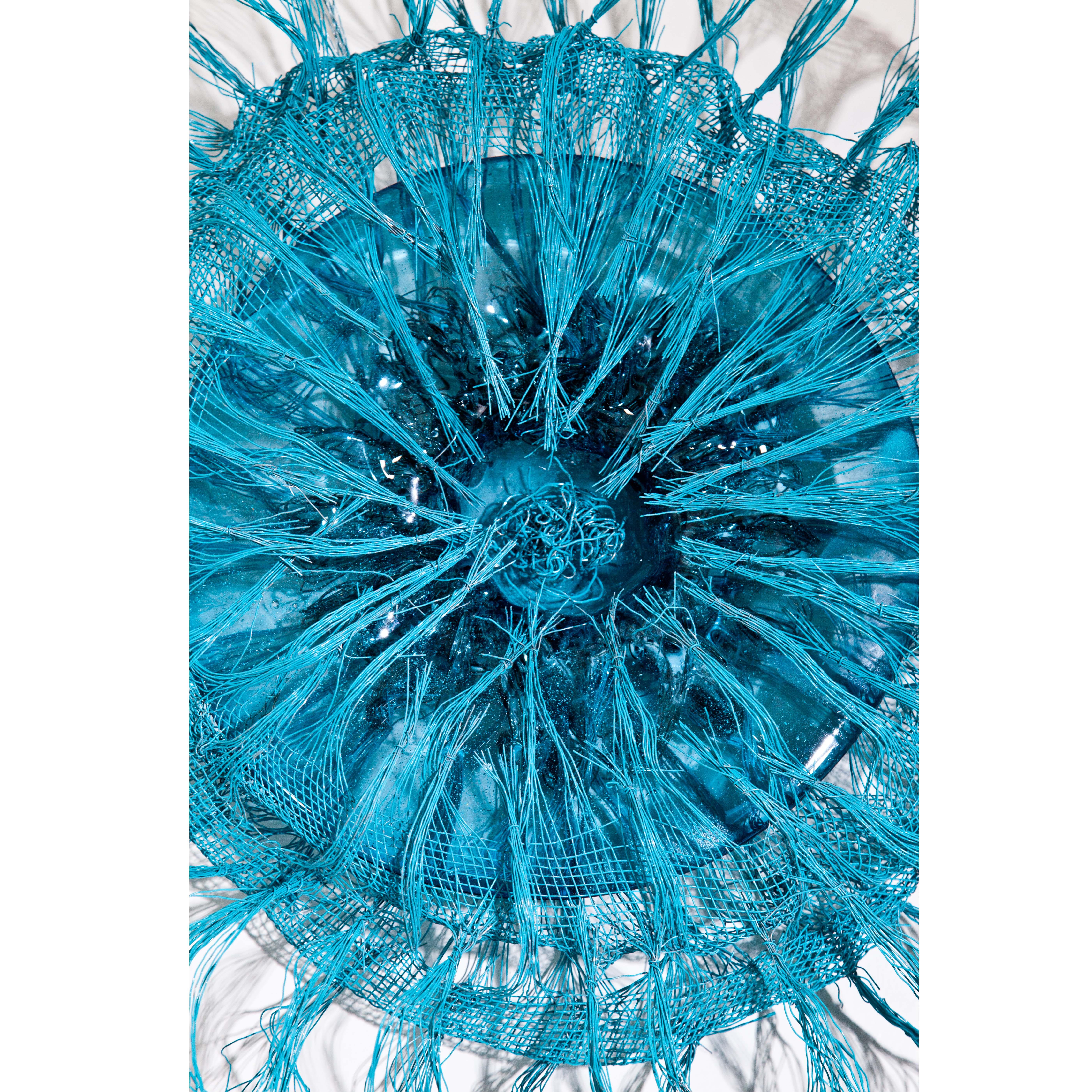 Large wall object made of hand-blown glass and wire in light blue. Despite the hard material, Aloni's objects possess an extraordinary soft quality, which is the optical attraction of the work.

Ron Aloni was born in 1950 in Israel. He attended the