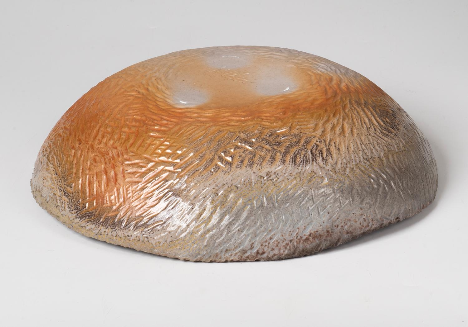 Slab built bowl. Beautiful mottled golden and brown tones produced in a 3 day wood fire.

Marc Cohen has over 30 years of experience as a professional photographer, printmaker and artist. He lives and works in New Jersey.