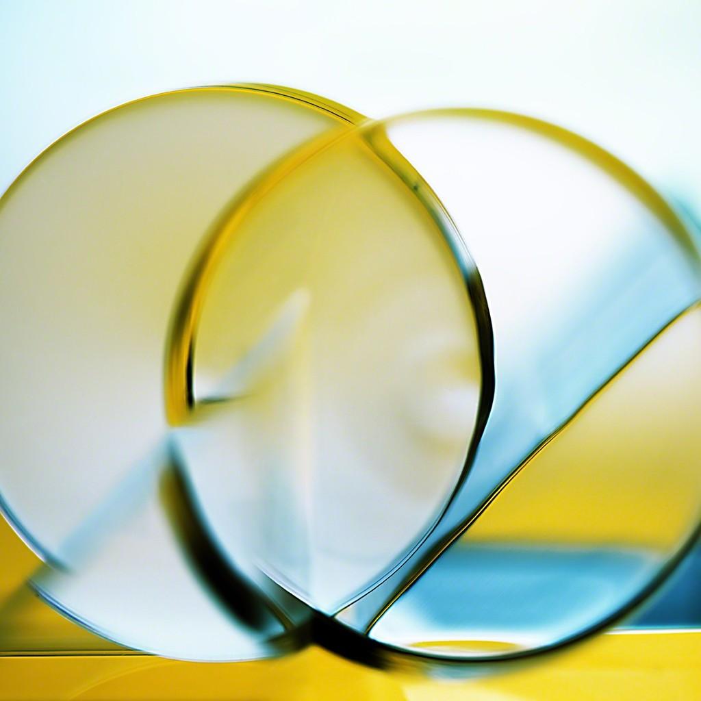 Deborah Bay Abstract Photograph - Angular Velocity - Bright blue & yellow geometric light abstract with circles
