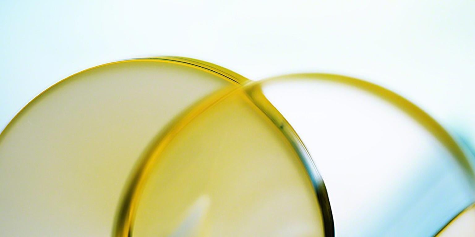 Angular Velocity - Bright blue & yellow geometric light abstract with circles - Photograph by Deborah Bay