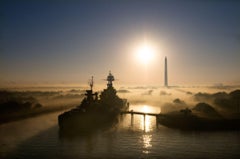 USS Texas - Ship channel at foggy sunrise with San Jacinto monument