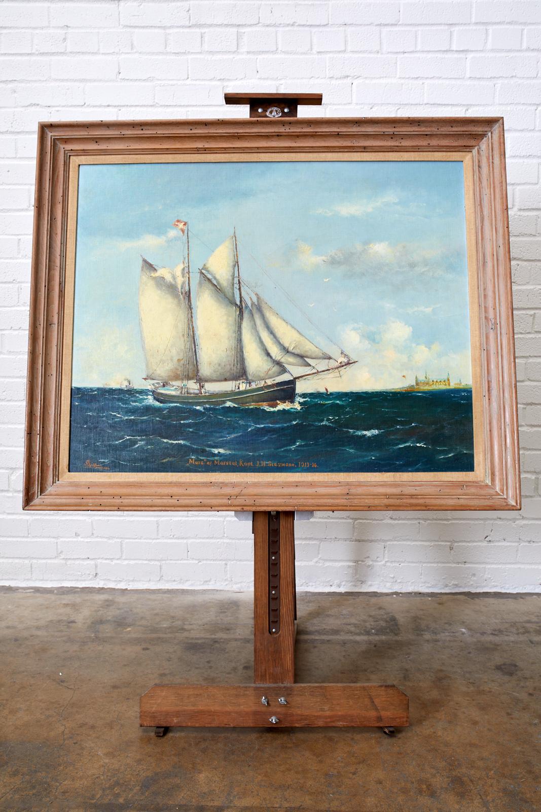 Impressive oil on canvas painting of a Danish sailing ship. Signed by artist on bottom left and notated as Marstal Denmark with the name and date of early 20th century captain. Art measures 36 wide by 29 inches high set in a large wooden frame. 