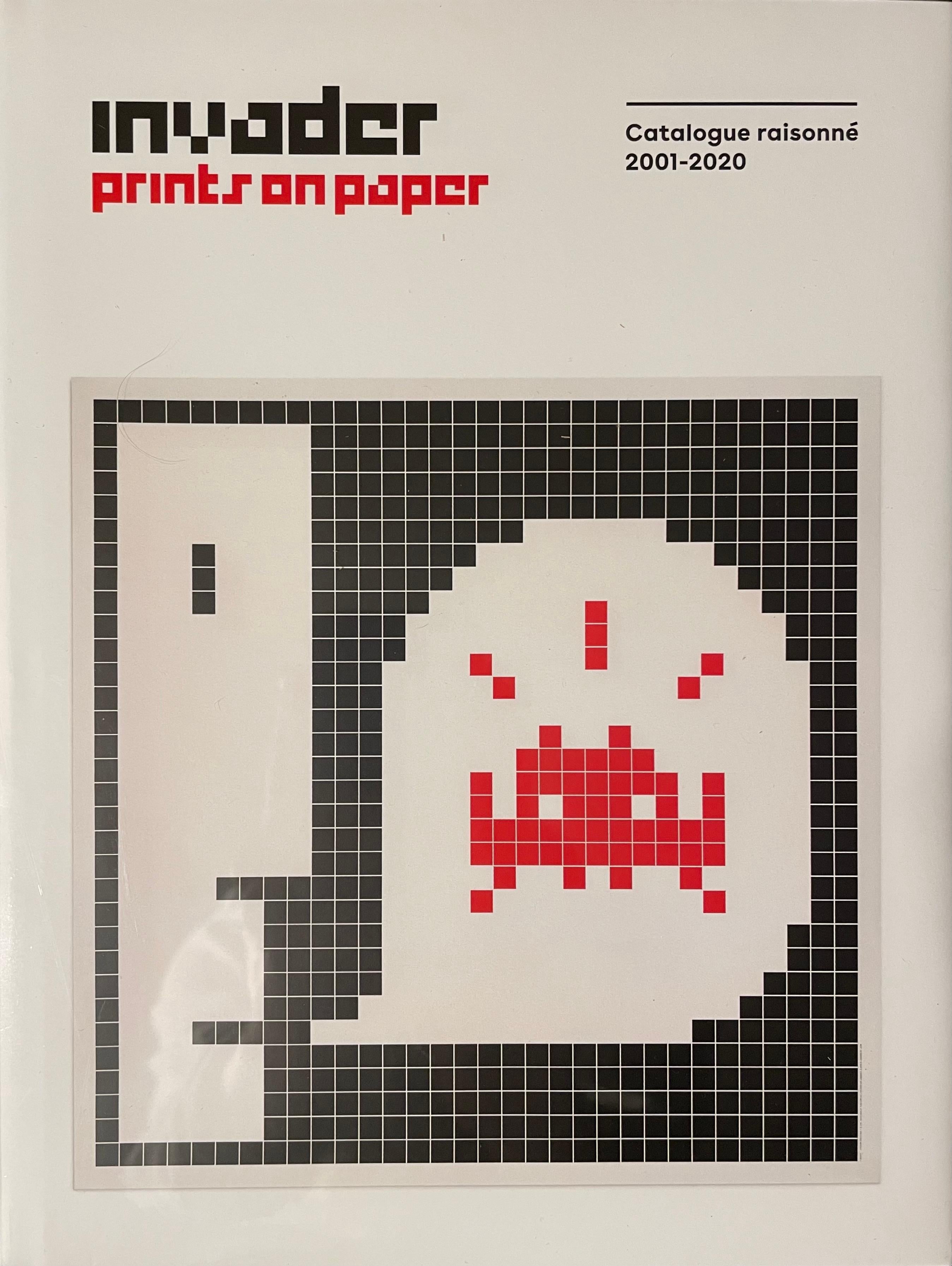 invader prints on paper book