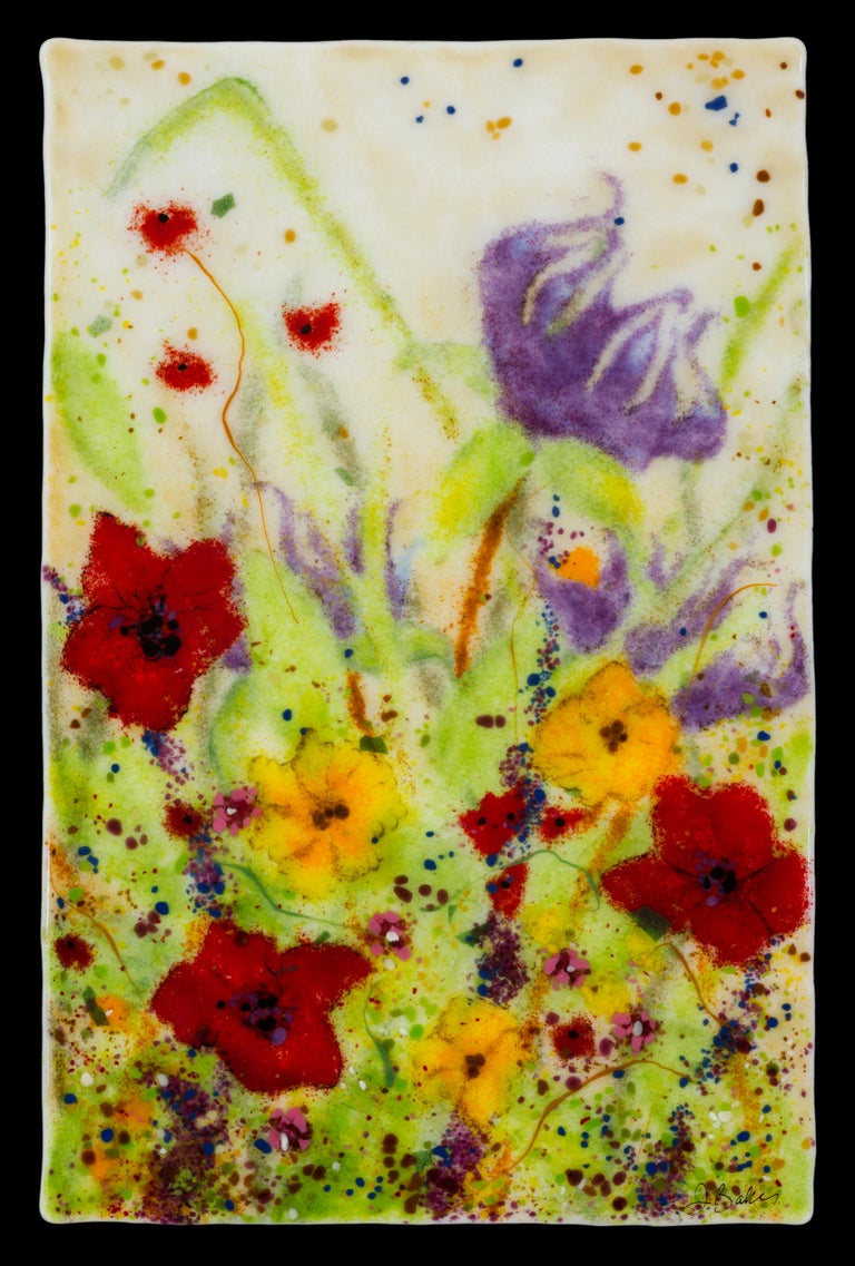 This floral, kiln formed glass artwork was created using layers of hand placed glass pieces. The piece is made to hang on a wall and is backed with a metal plate that has a standard hanging wire.  The edges are a natural, slightly irregular shape