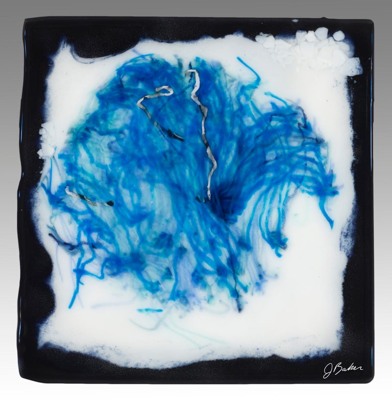 Inspired by the sea and created by glass artist, Jennifer Baker, more than 100 glass rods were placed in loose glass pieces, bordered in a dark, midnight blue glass and heated in a glass kiln to temperatures over 1500 degrees to create this one of a