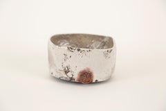 "RAKU RED AND WHITE", wheel formed white glaze, copper red, gold leaf, sculpture