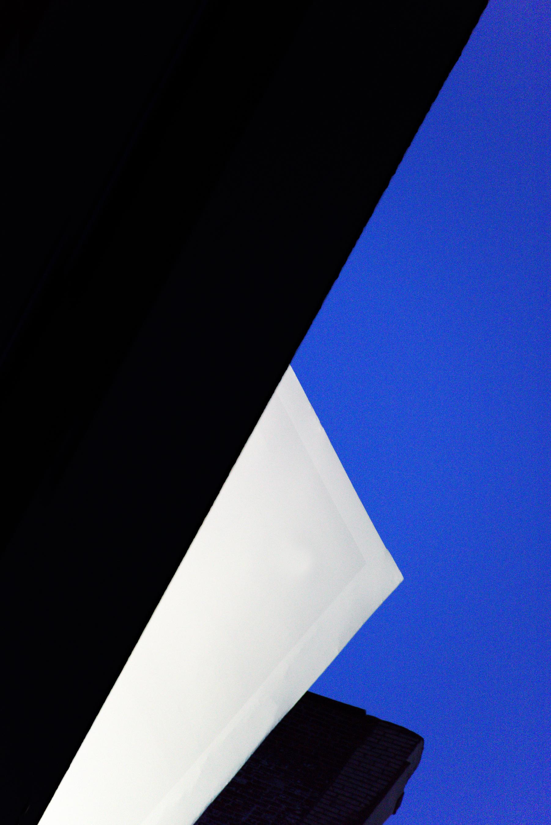 Bob Krasner Landscape Photograph - "One Billboard, Two Buildings", photograph, city, architecture, geometry, blue