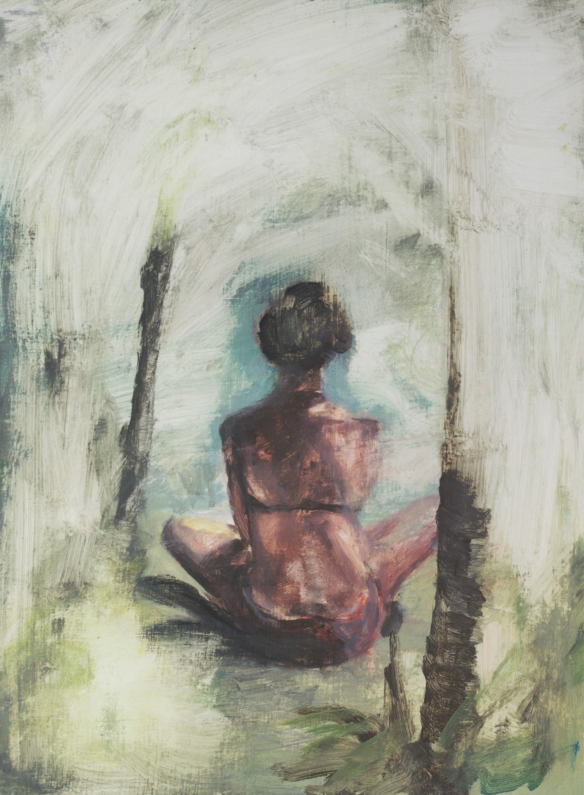 woman sitting on bed painting