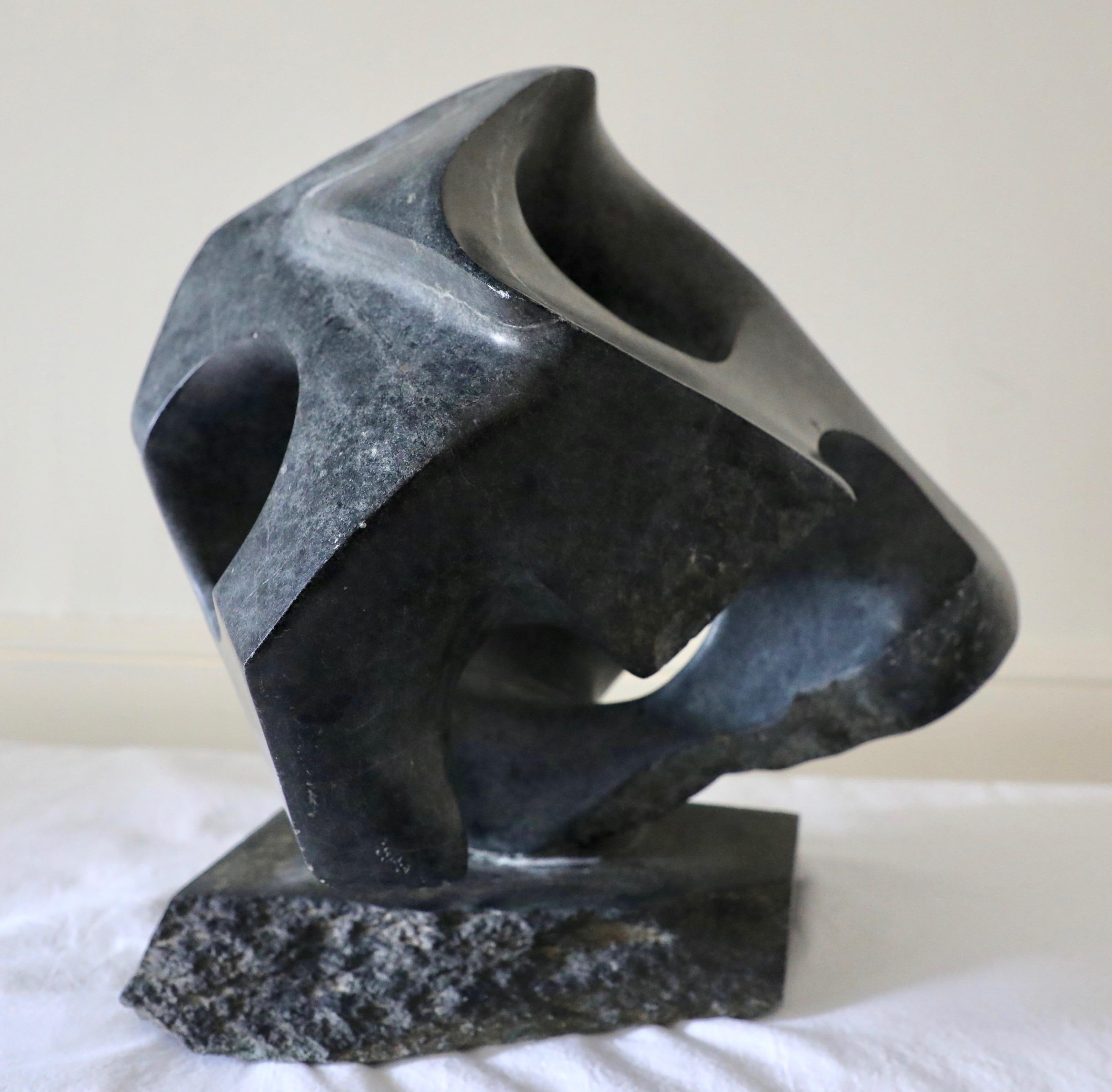 This is a large and bold sculpture carved from Virginia soapstone by Virginia sculptor David Breeden.  This piece can make quite an impact on a coffee table or in an entryway.  The work pivots and turns on its soapstone base.  

American sculptor