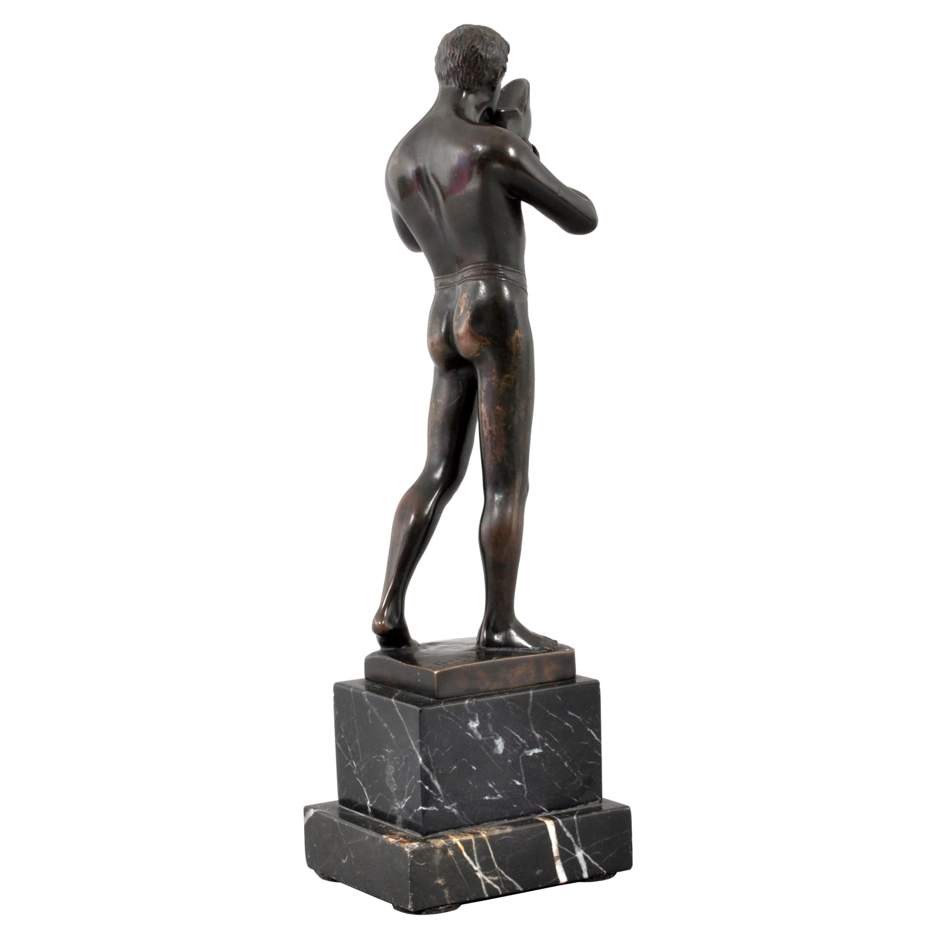 Antique Neo-classical Austrian Bronze Male Figure by Ernst Beck (1879-1941), Circa 1910. The bronze depicting a nude male figure from antiquity, wearing a loin cloth and drinking from a Grecian helmet. The bronze signed 
