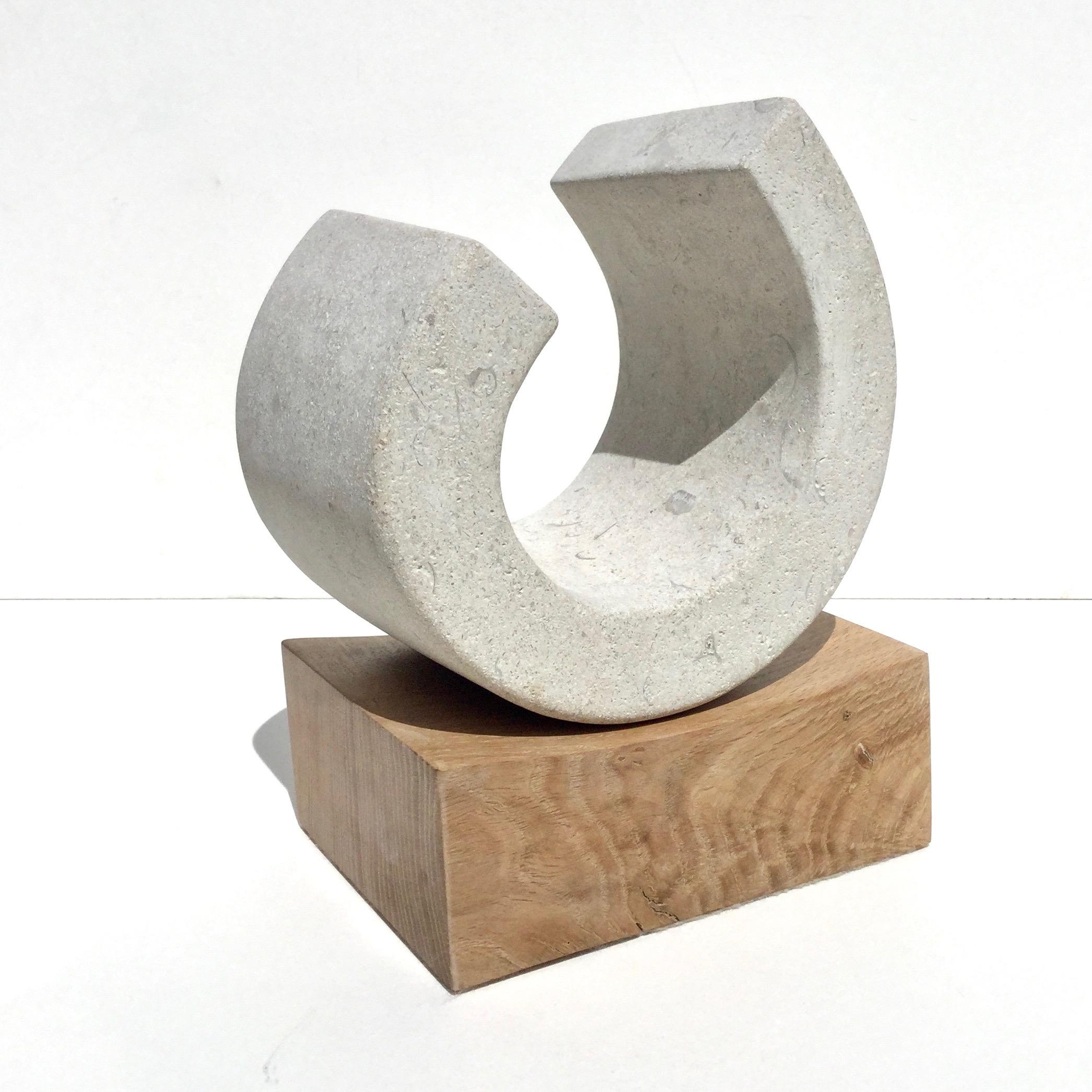 You III, Richard Fox. Small abstract stone sculpture on oak plinth, carved 1
