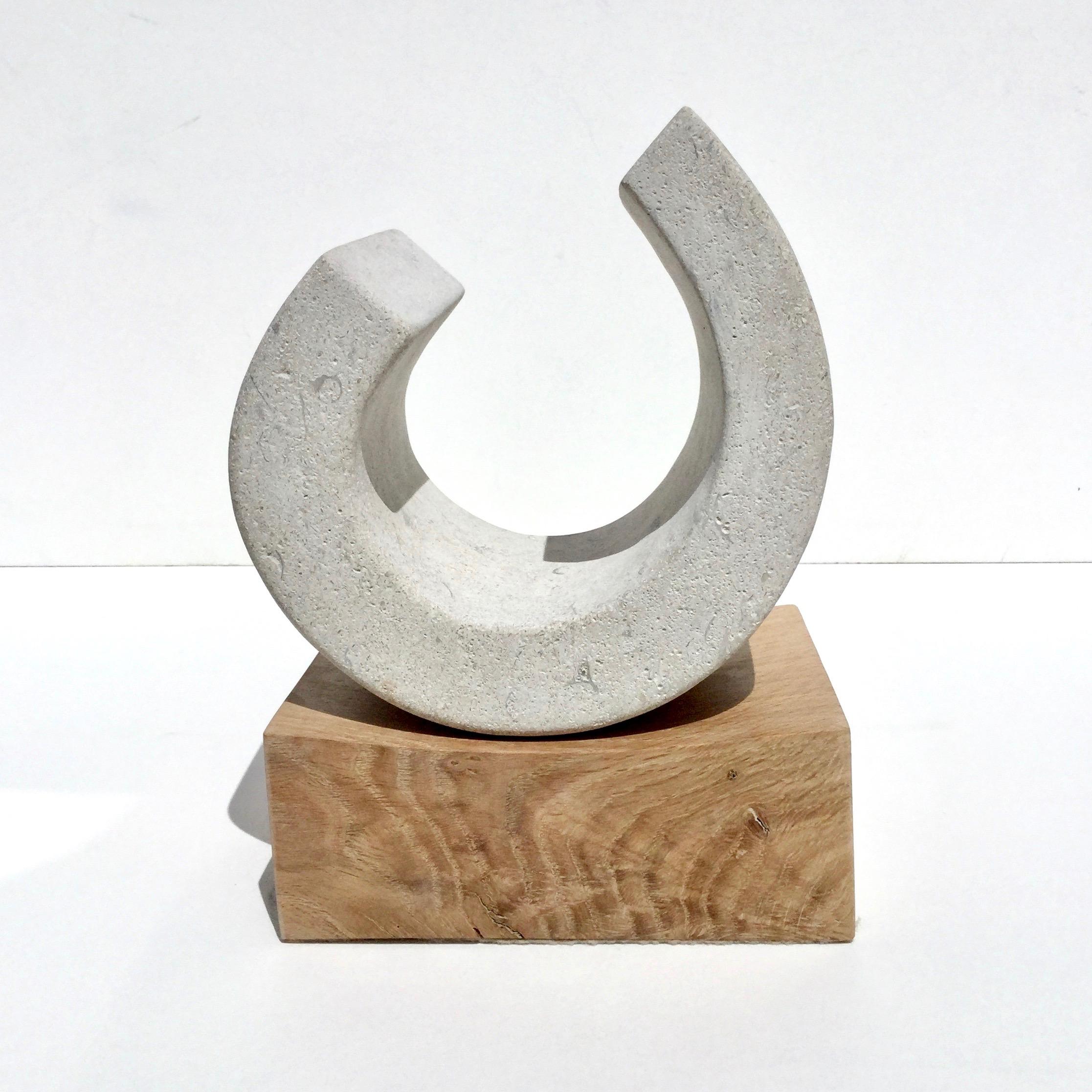 Hartham stone and kiln-dried oak base.


Richard Fox started to focus on his form of sculpture in 2005. After visiting Barbara Hepworth's studio and seeing her wood sculptures, he spent innumerable hours on creating his unique method of sculpting